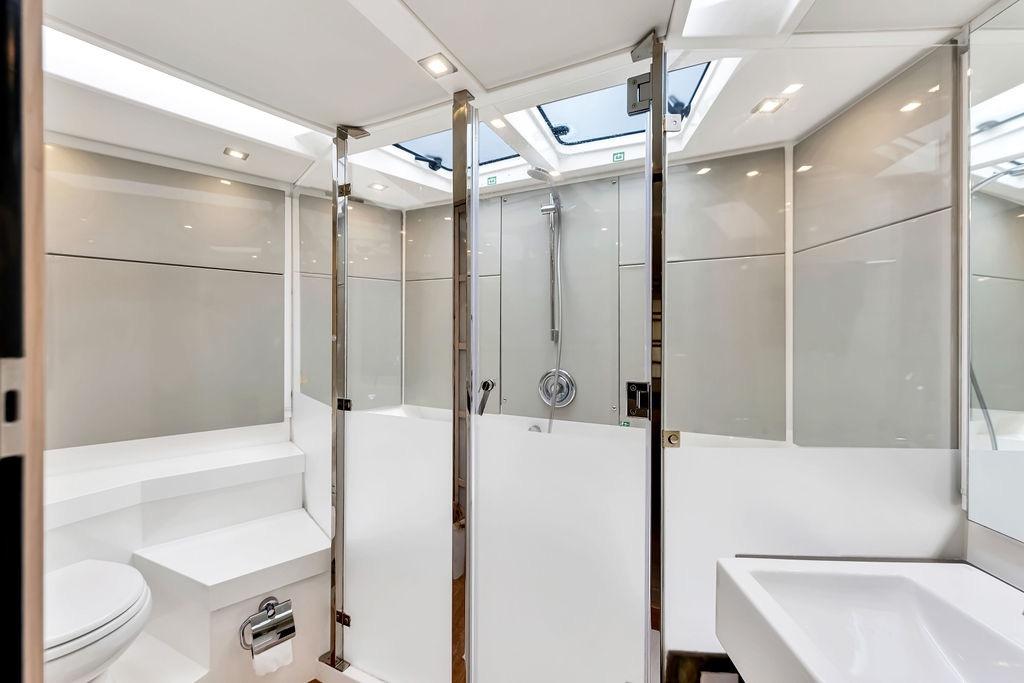Luxurious bathroom interior of 2012 Fairline Targa 58 yacht with modern fixtures and skylight.
