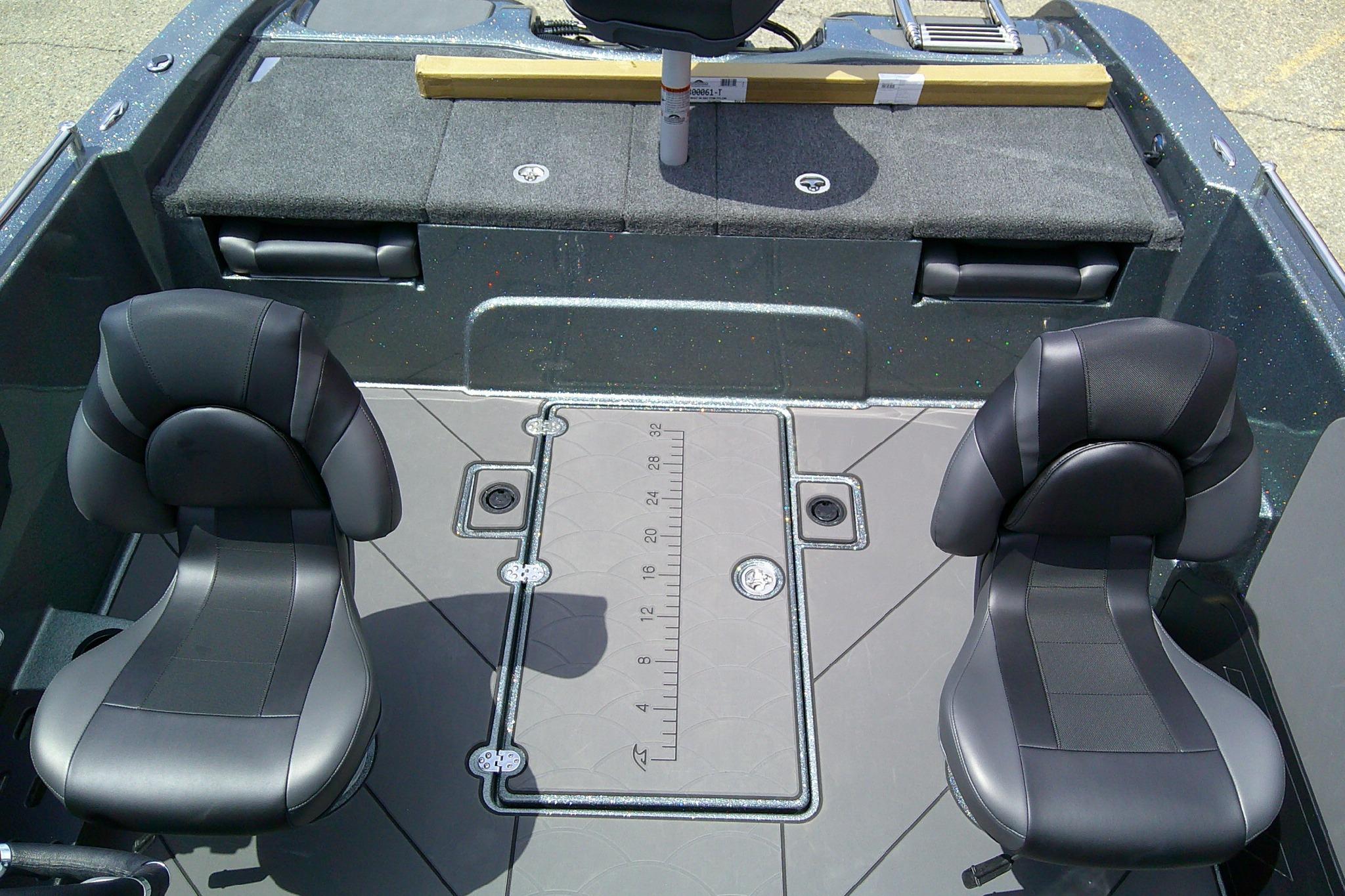 Interior of 2026 Nitro ZV19 Sport boat with two black seats and storage compartments.