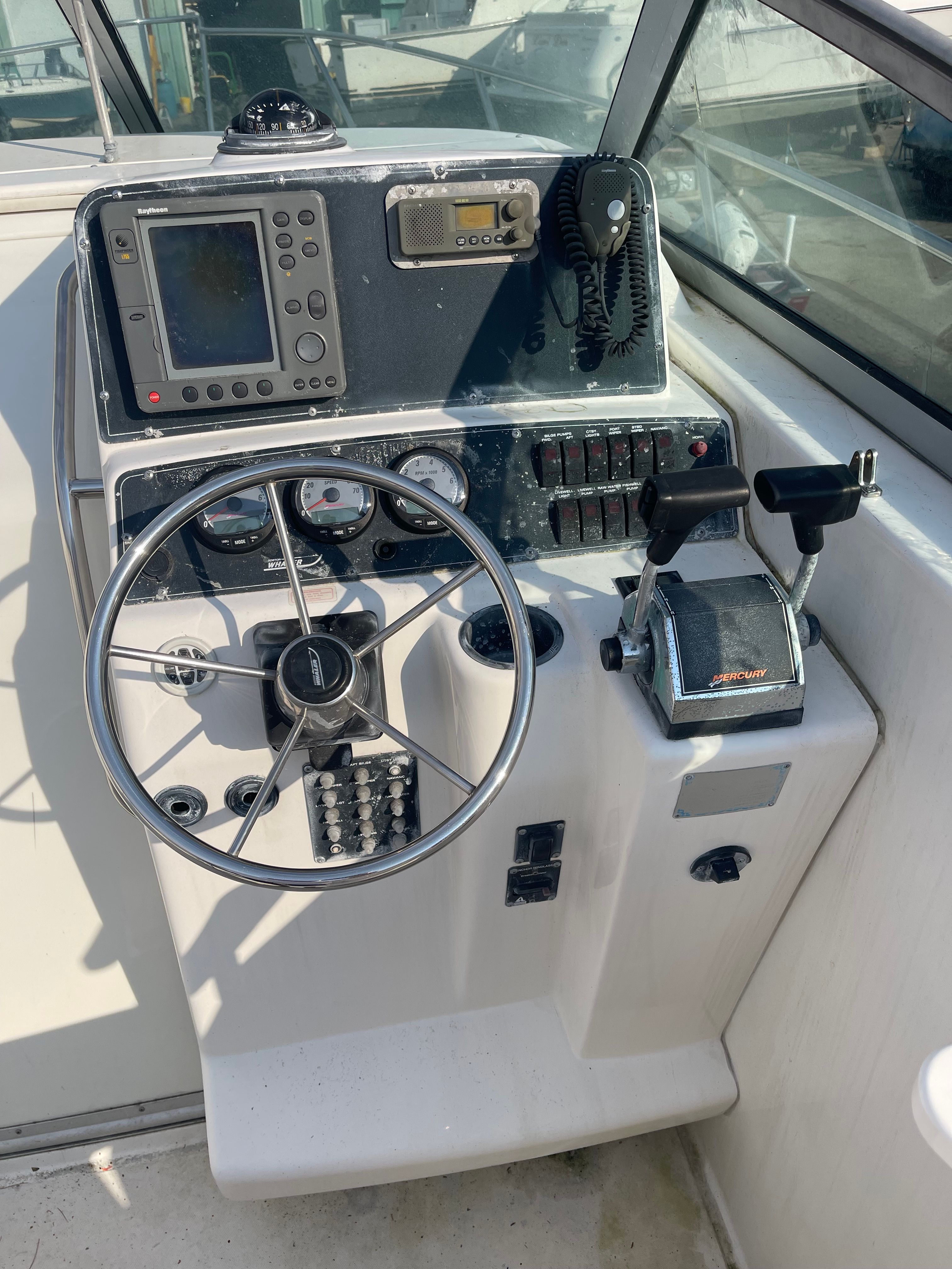 Helm console of a 2001 Boston Whaler 26 Conquest boat.