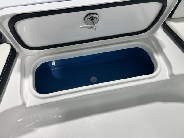 2025 Tidewater 2300 Carolina Bay boat storage compartment with blue interior.