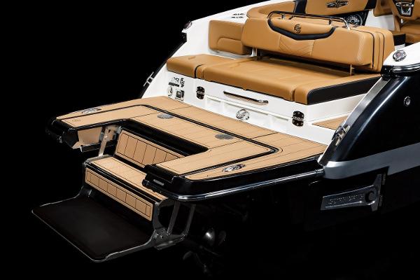2024 Chaparral 28 Surf boat with luxurious tan seating and sleek swim platform.