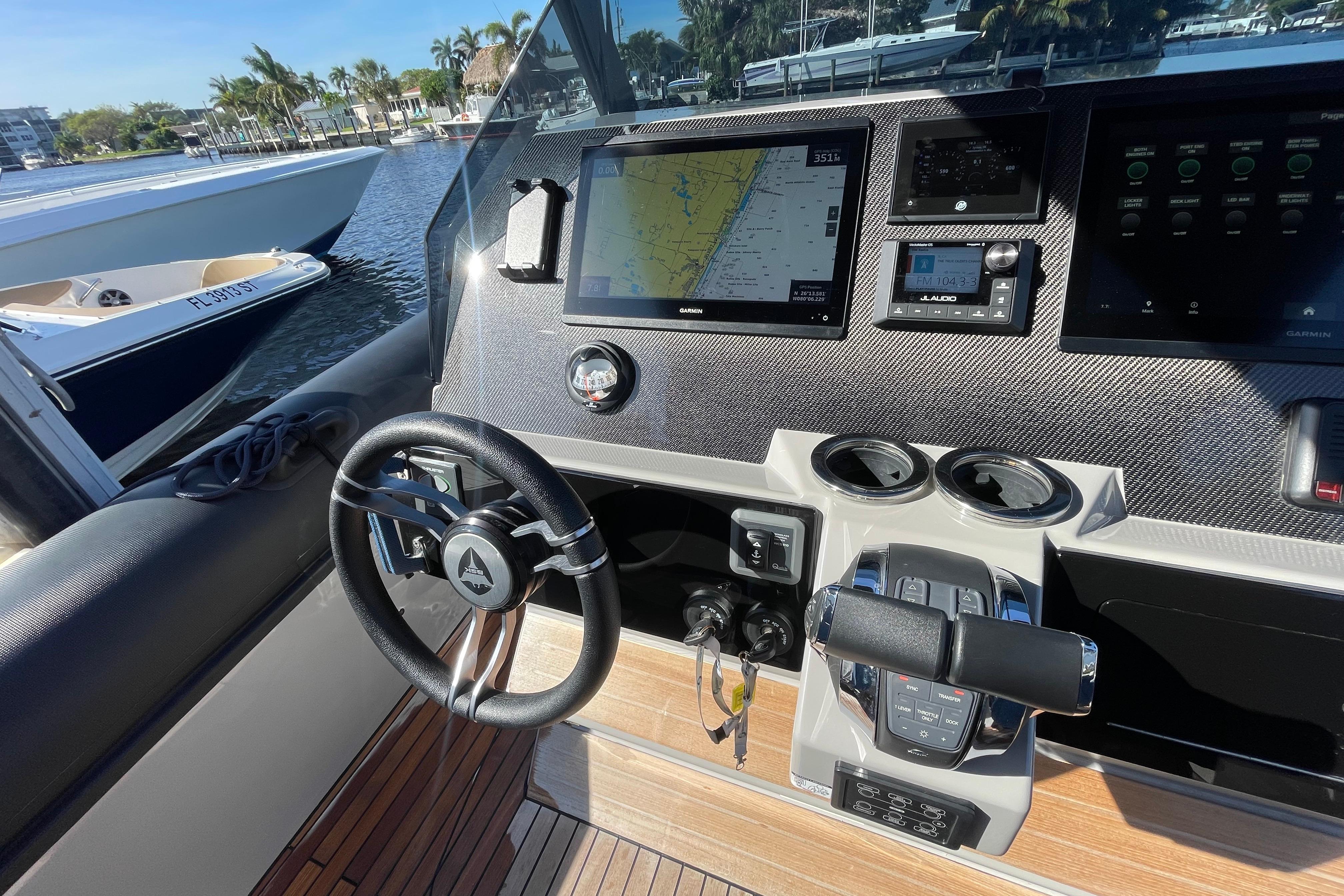 Cockpit of 2023 Skipper-BSK BSK 38 boat with advanced navigation system and steering wheel.
