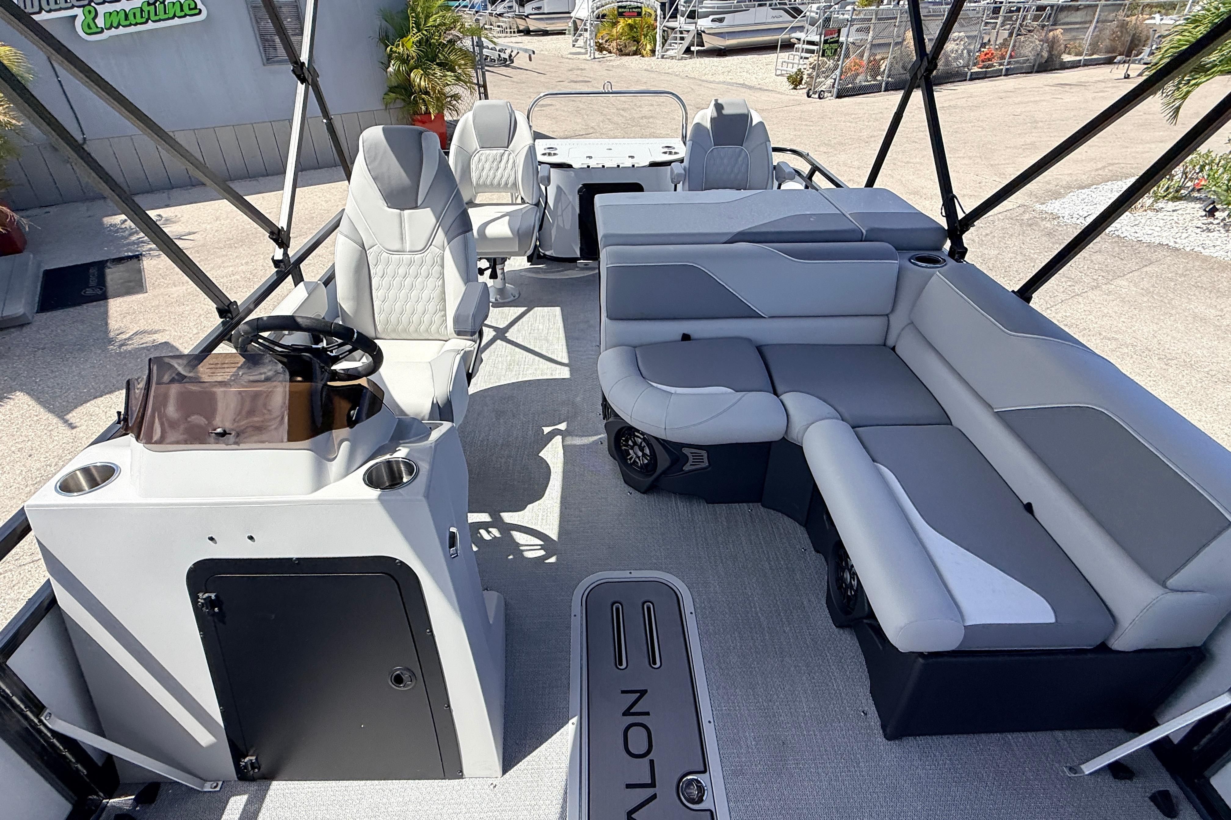 2026 Avalon 2385 Venture 85 Tri Toon boat interior with seating and steering console.