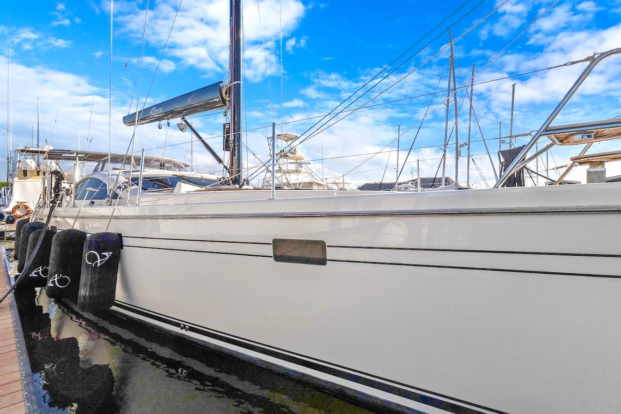 Sailing yacht Southerly 57 RS, 2011 model, docked at marina under blue sky.