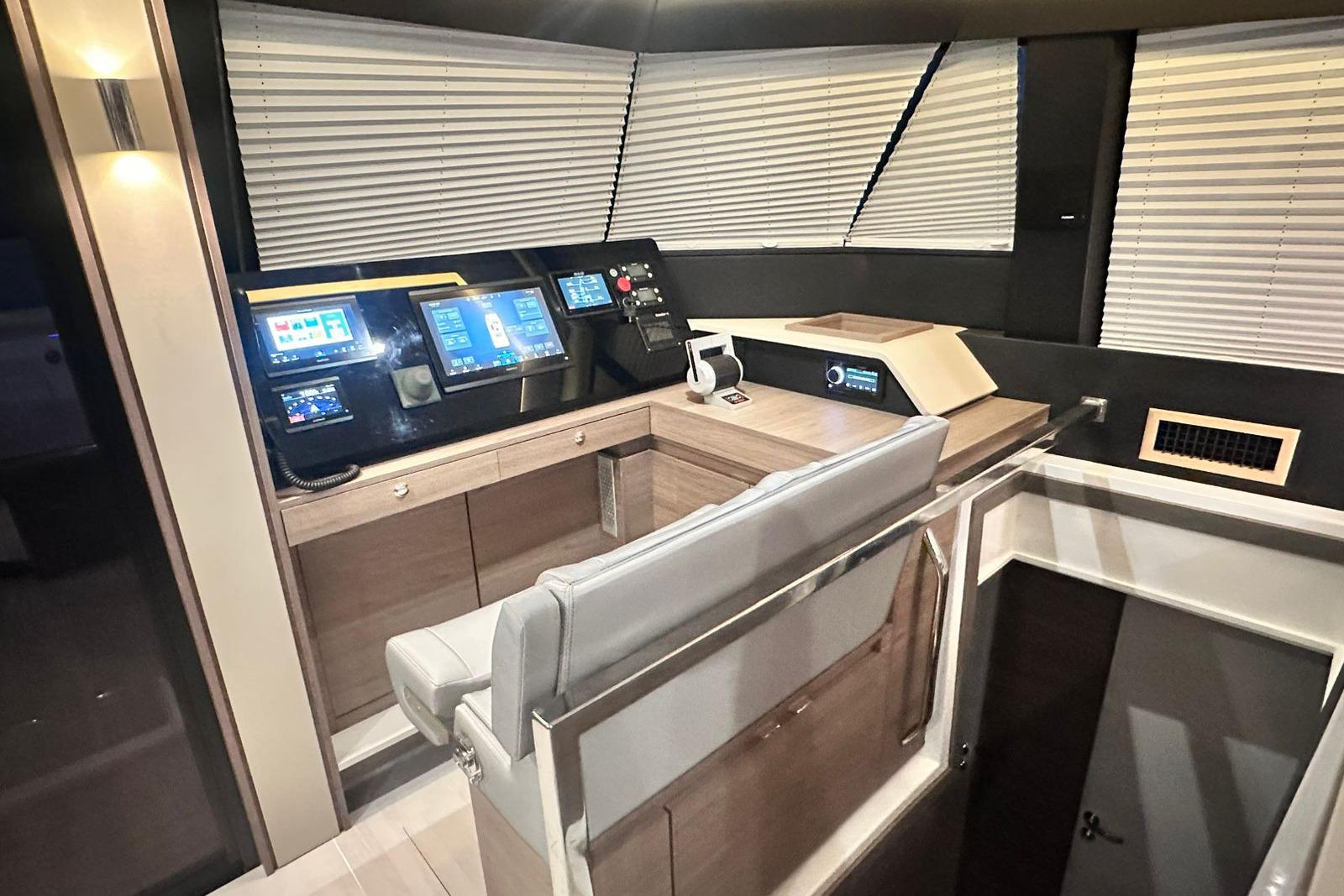Modern helm station of 2026 Aventura 56 Motor Yacht with advanced navigation displays.