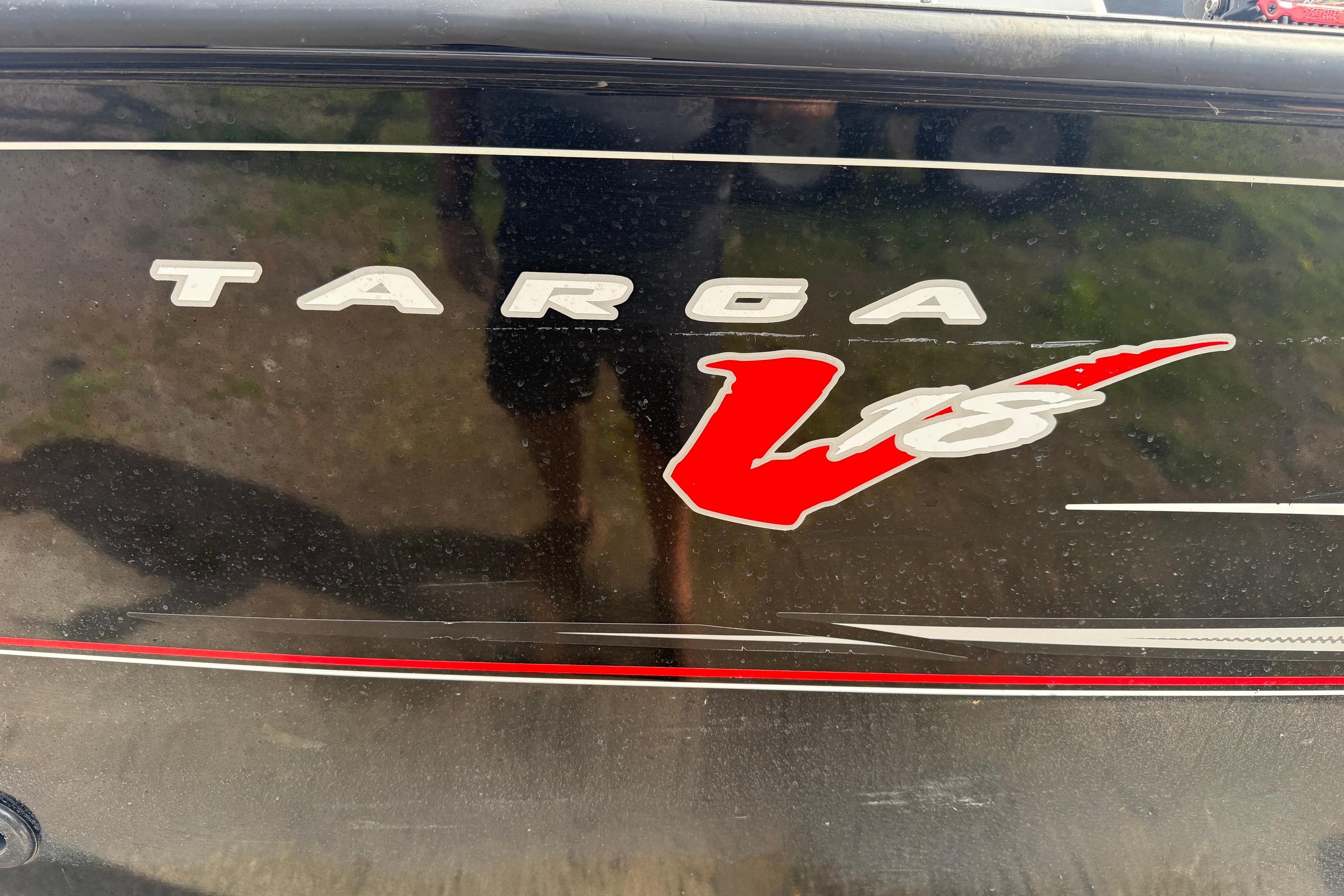 2016 Tracker Targa V-18 WT boat logo on black surface.
