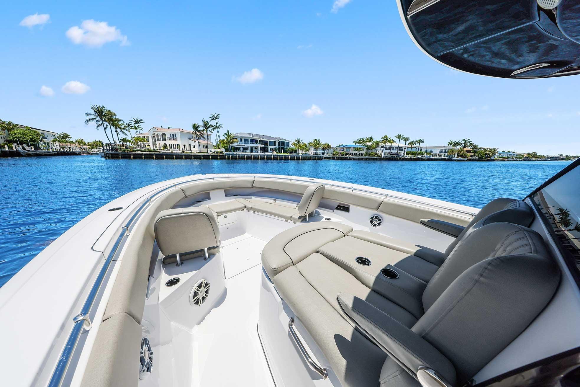 2024 Sportsman Open 352 Center Console boat on a sunny waterfront.
