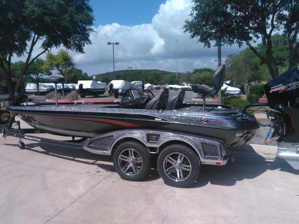 2025 Ranger Z520R Cup-Equipped boat on trailer, parked outdoors under clear sky.