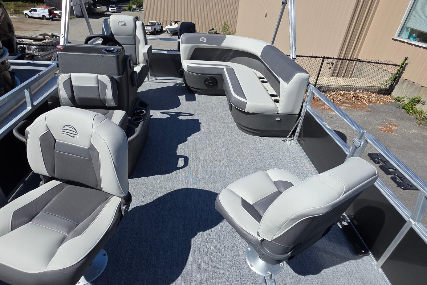 2026 Sun Tracker BB 16 XLS pontoon boat interior with gray seating and steering console.