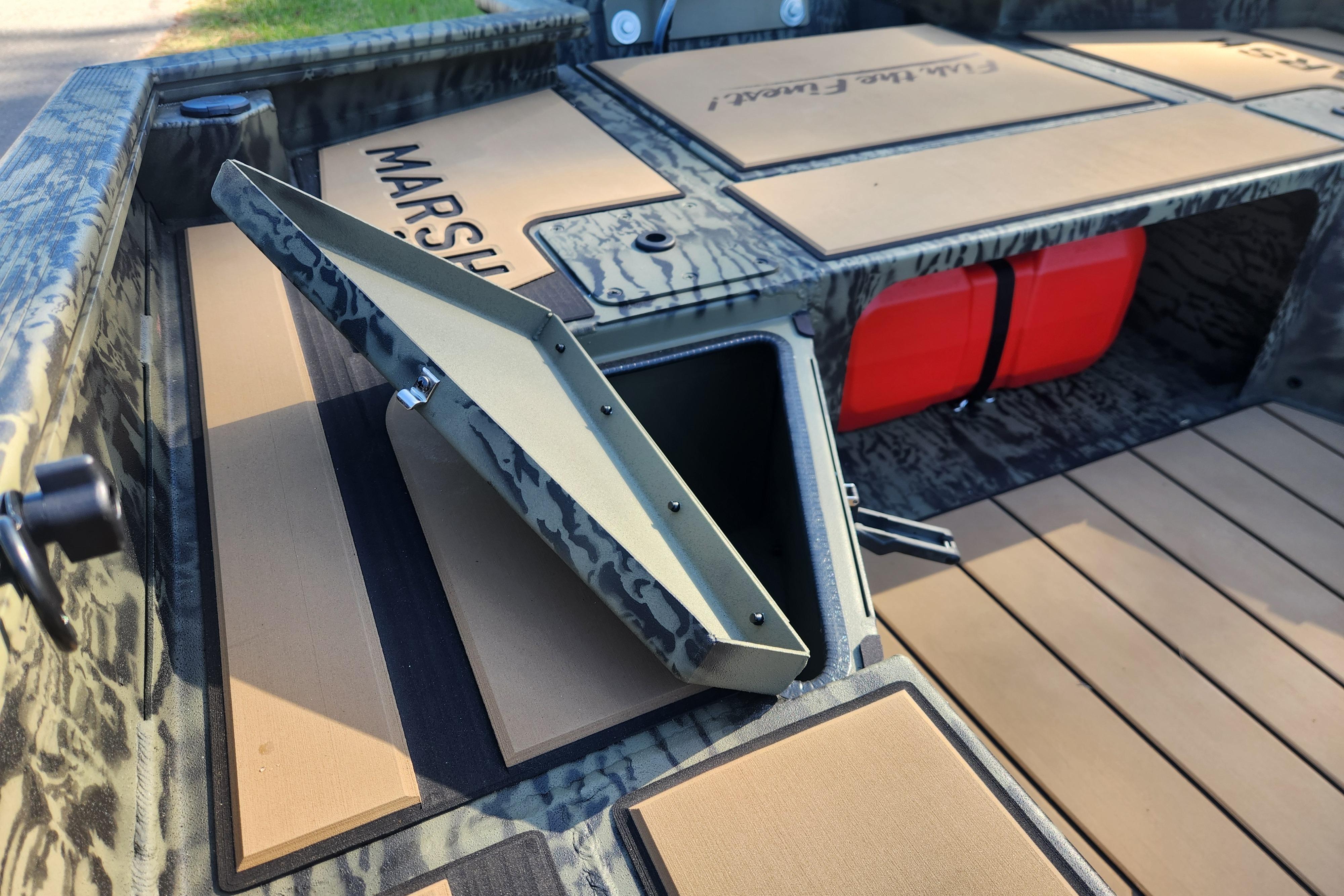 2026 Tracker Grizzly 1756 T Marsh boat interior with storage compartment open.