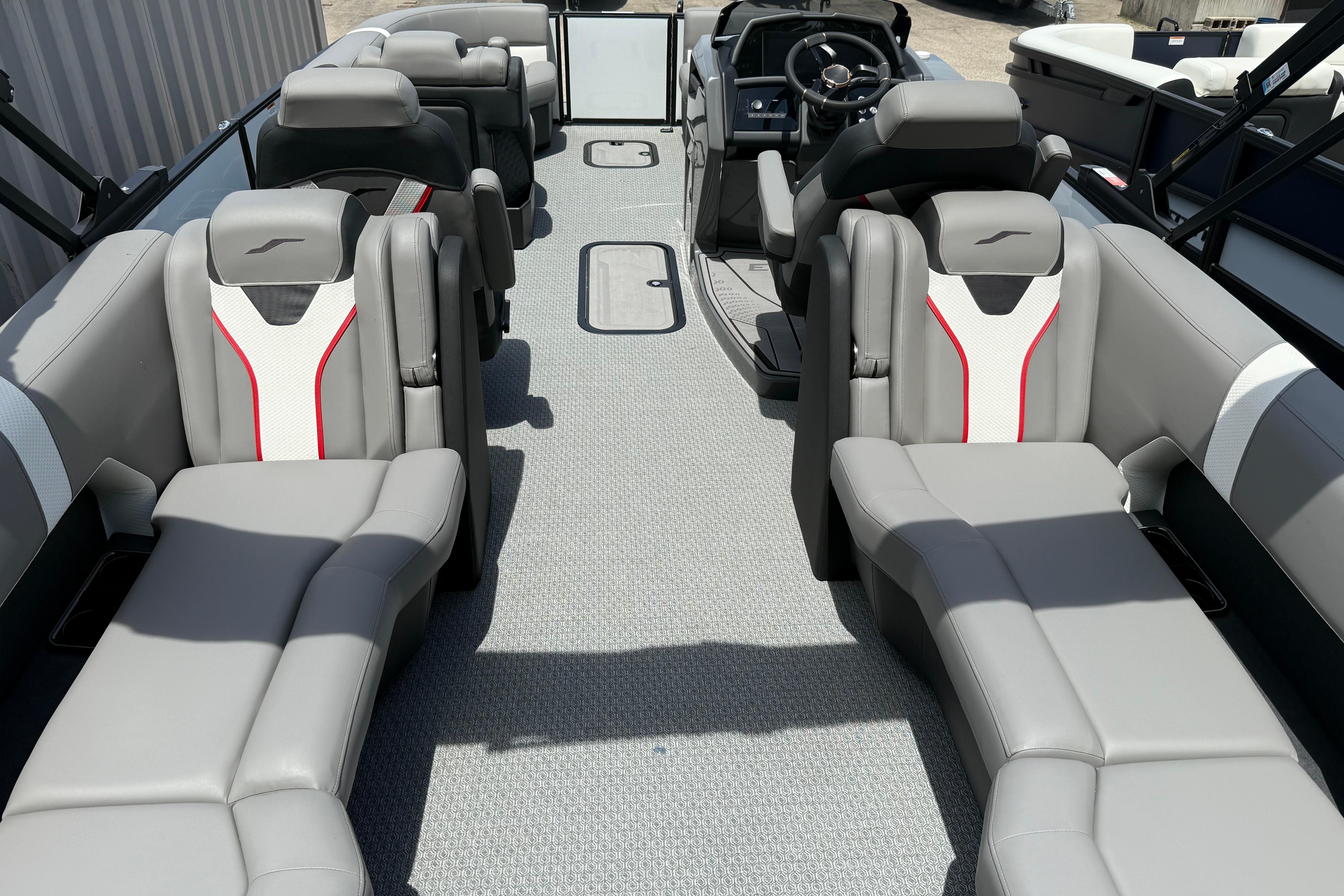 Luxurious interior of 2026 Evotti 723QL boat with modern seating and sleek design.