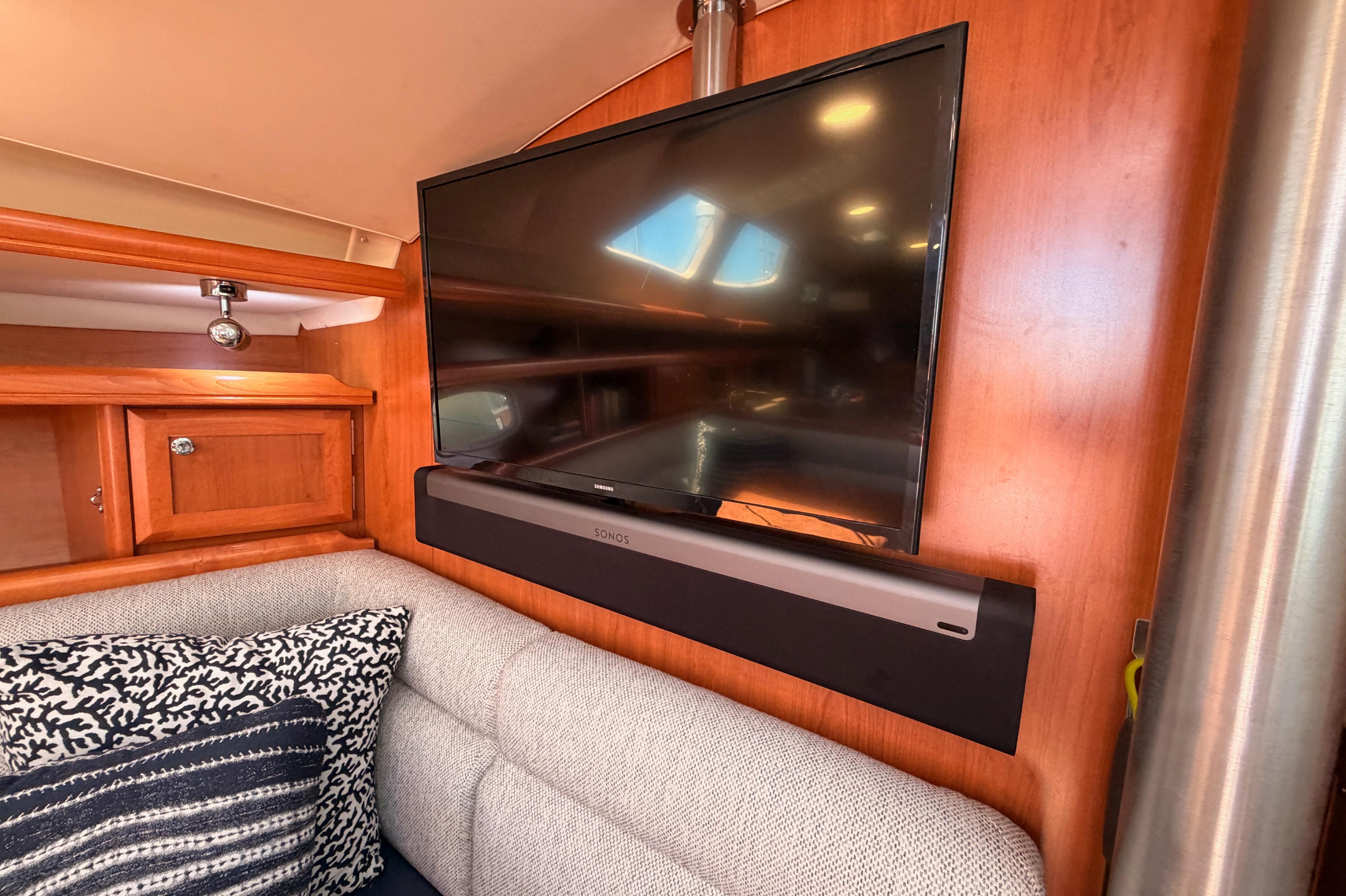 Interior of 2008 Hunter 45 Deck Salon with TV and soundbar setup.
