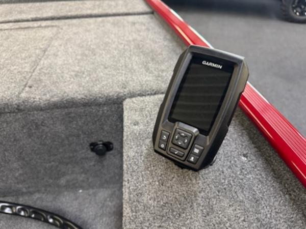 2025 Tracker Panfish 17 boat with Garmin fishfinder on carpeted deck.