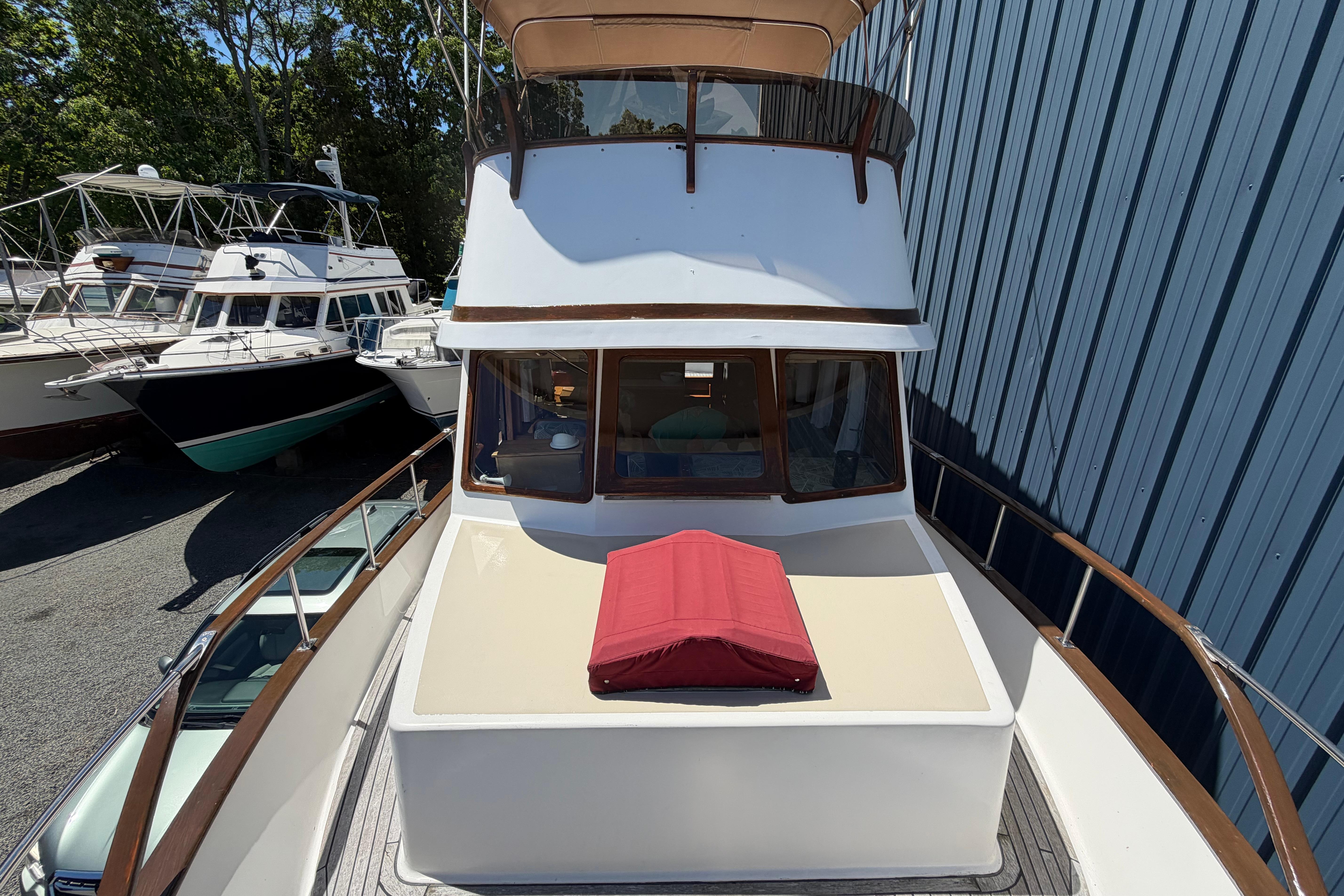 1987 Marine Trader 36 yacht docked, featuring a spacious deck and classic design.