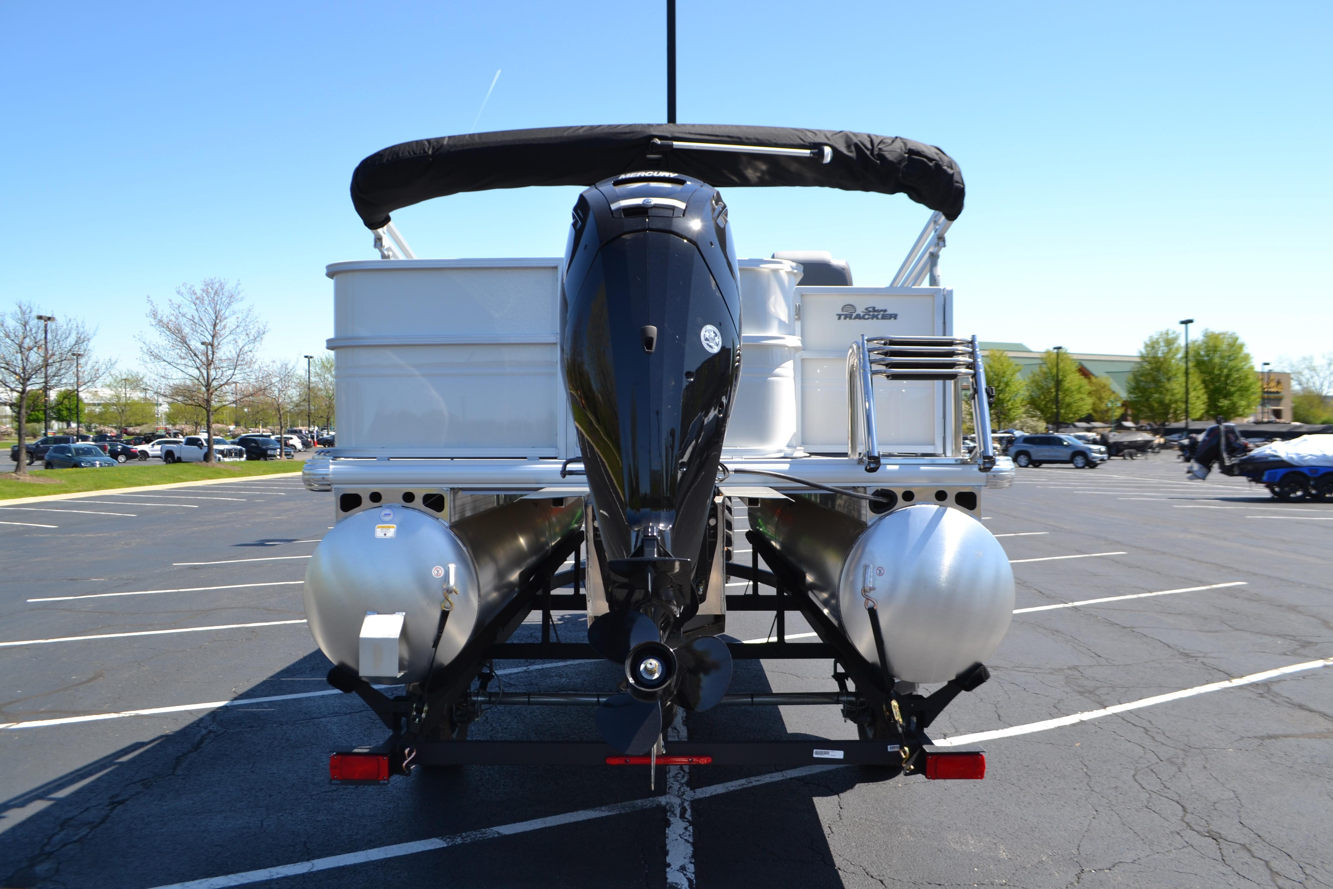 2026 Sun Tracker Party Barge 18 DLX pontoon boat on trailer, rear view.