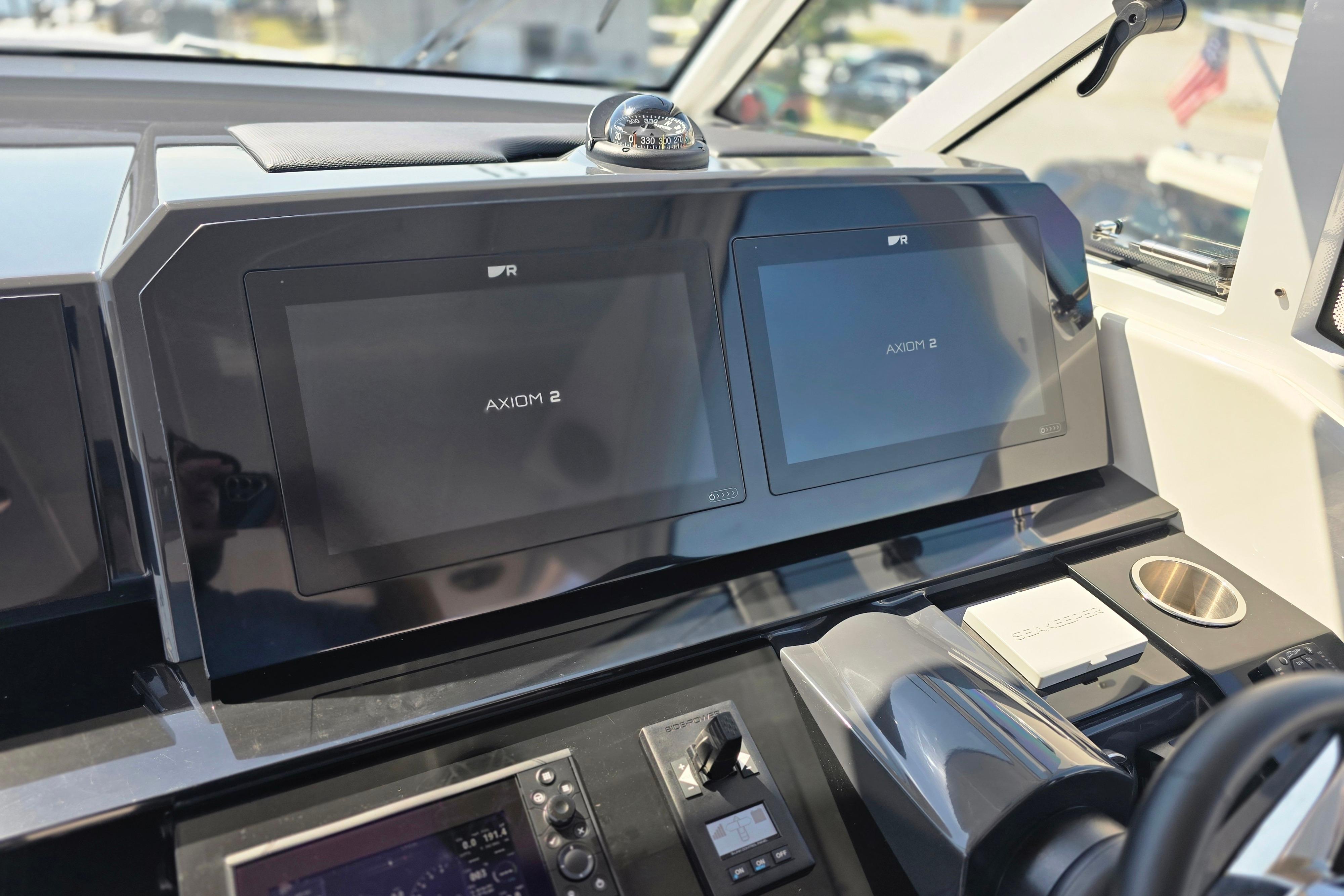 2025 Formula 380 Super Sport Crossover OB dashboard with dual Axiom 2 displays.