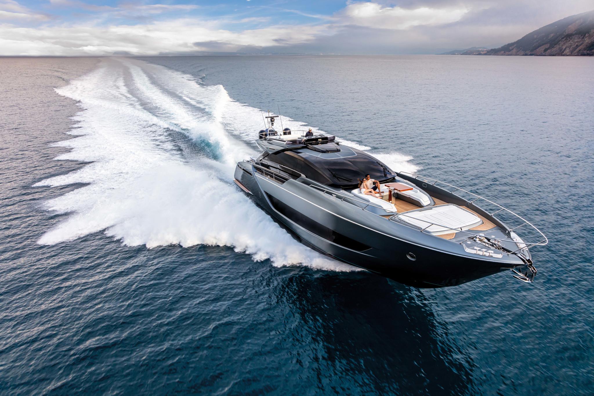 Luxury 2025 Riva Folgore yacht cruising on open sea under clear skies.