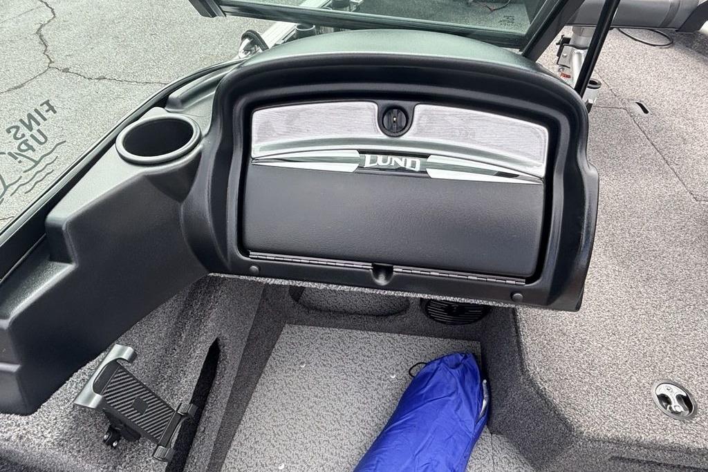 2021 Lund 1675 Adventure Sport boat interior with glove compartment and cup holder.