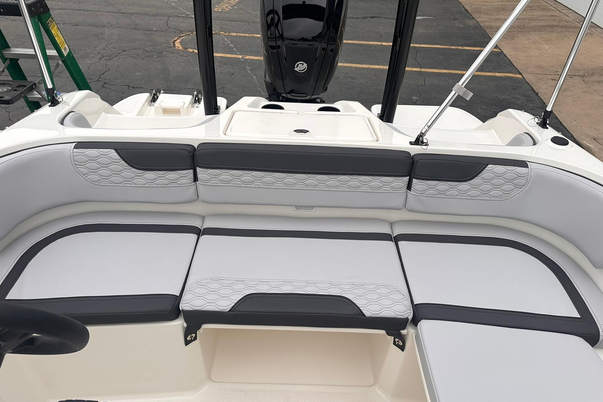 2026 Bayliner M17 boat interior with cushioned seating and modern design.