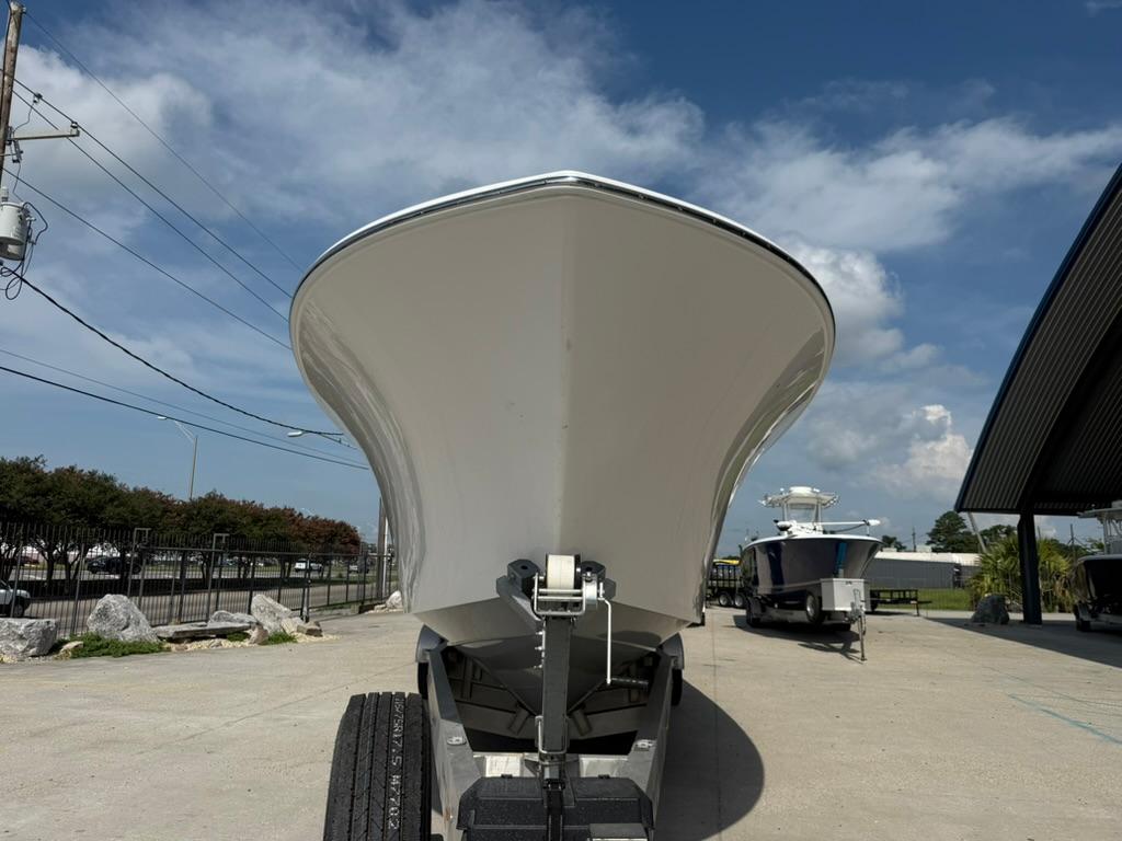 2024 Front Runner 39 CC boat on trailer, viewed from the front under a clear sky.