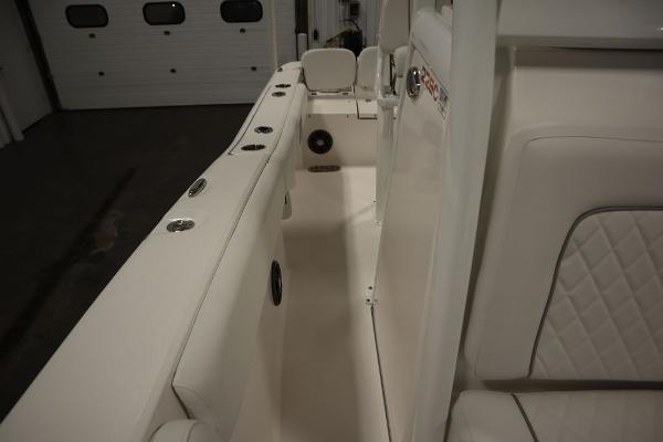 2025 Sea Fox 228 Commander boat interior with white seating and rod holders.