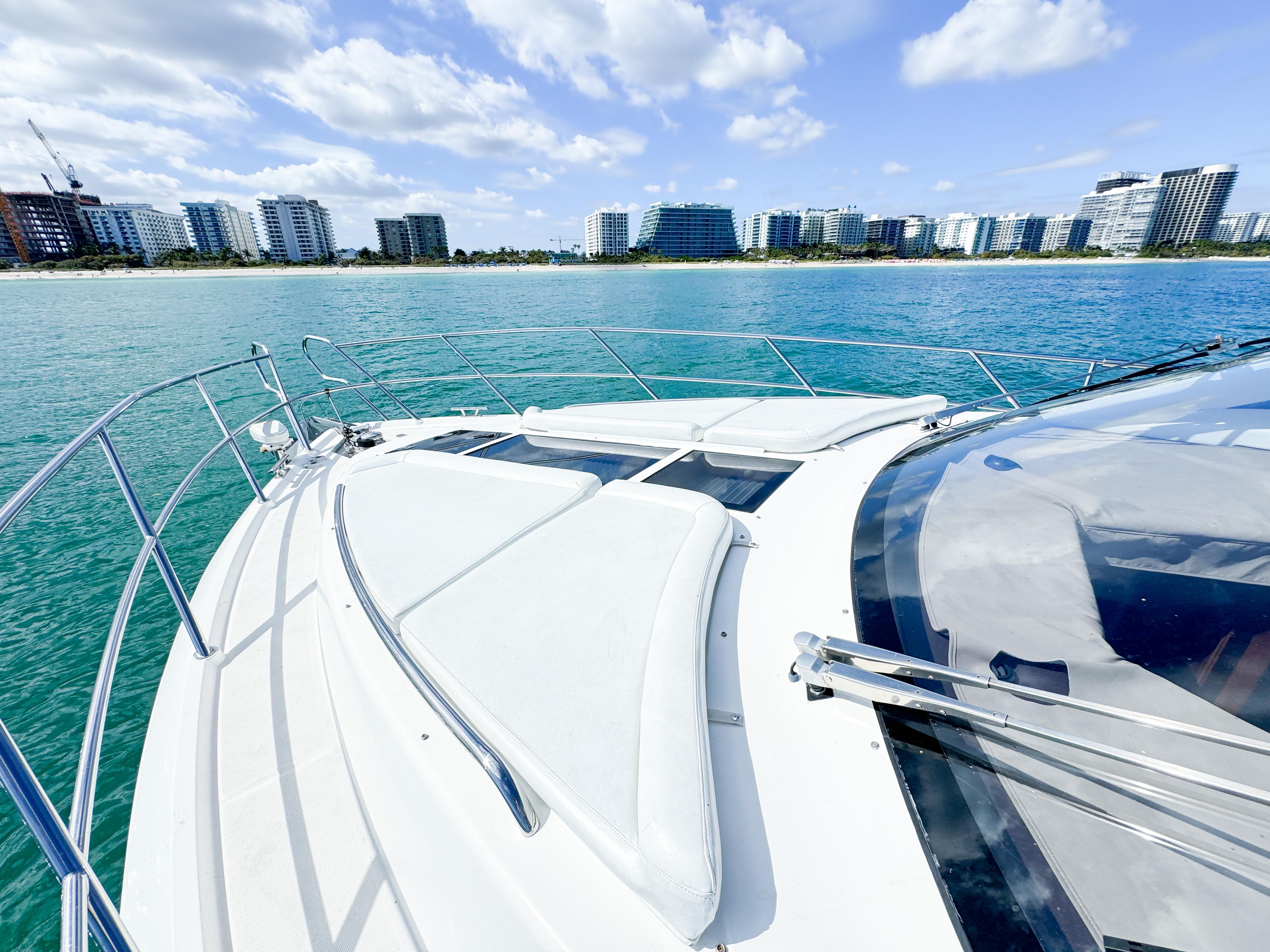 Galeon 420 Fly 2016 yacht cruising near modern city skyline.