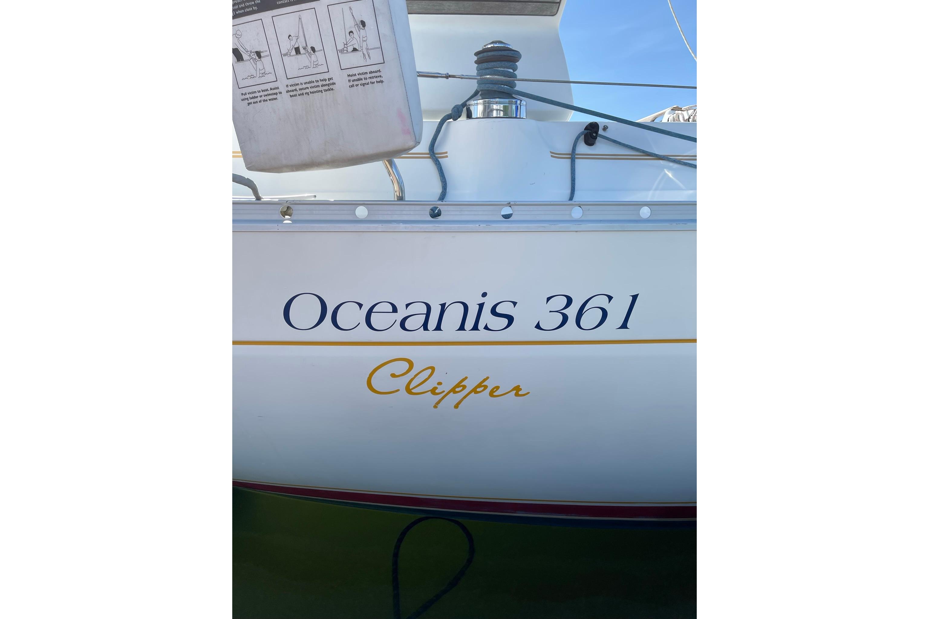2001 Beneteau Oceanis 361 Clipper sailboat, side view with name and model visible.