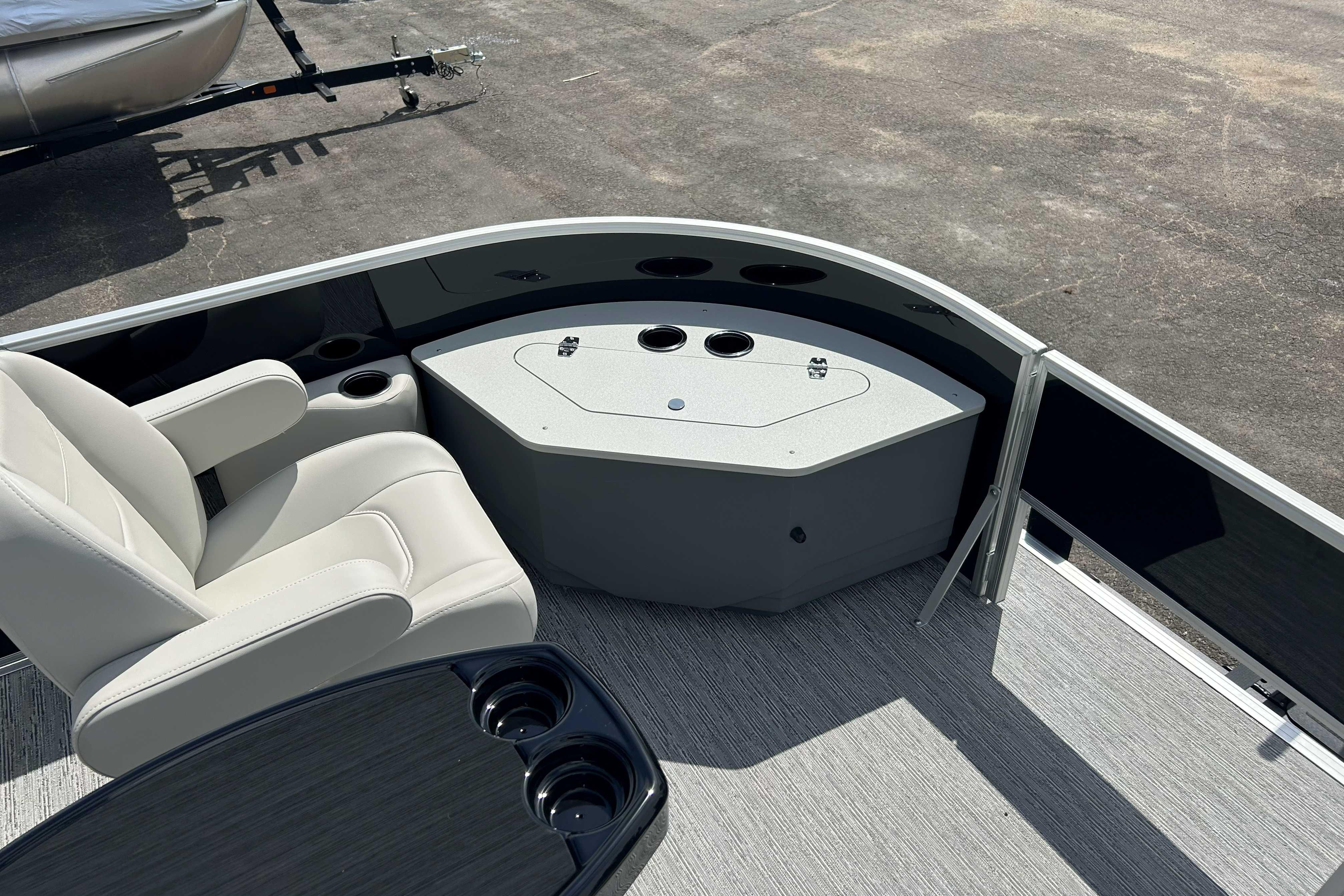 2026 Starcraft EX 22 FD boat interior with seating and cup holders.