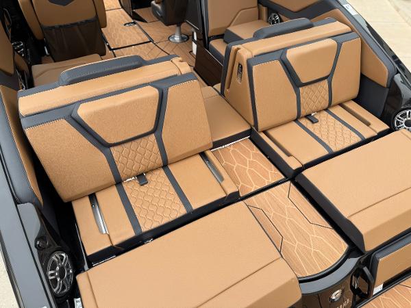 2025 Yamaha Boats 255XD interior with luxurious tan and black seating.