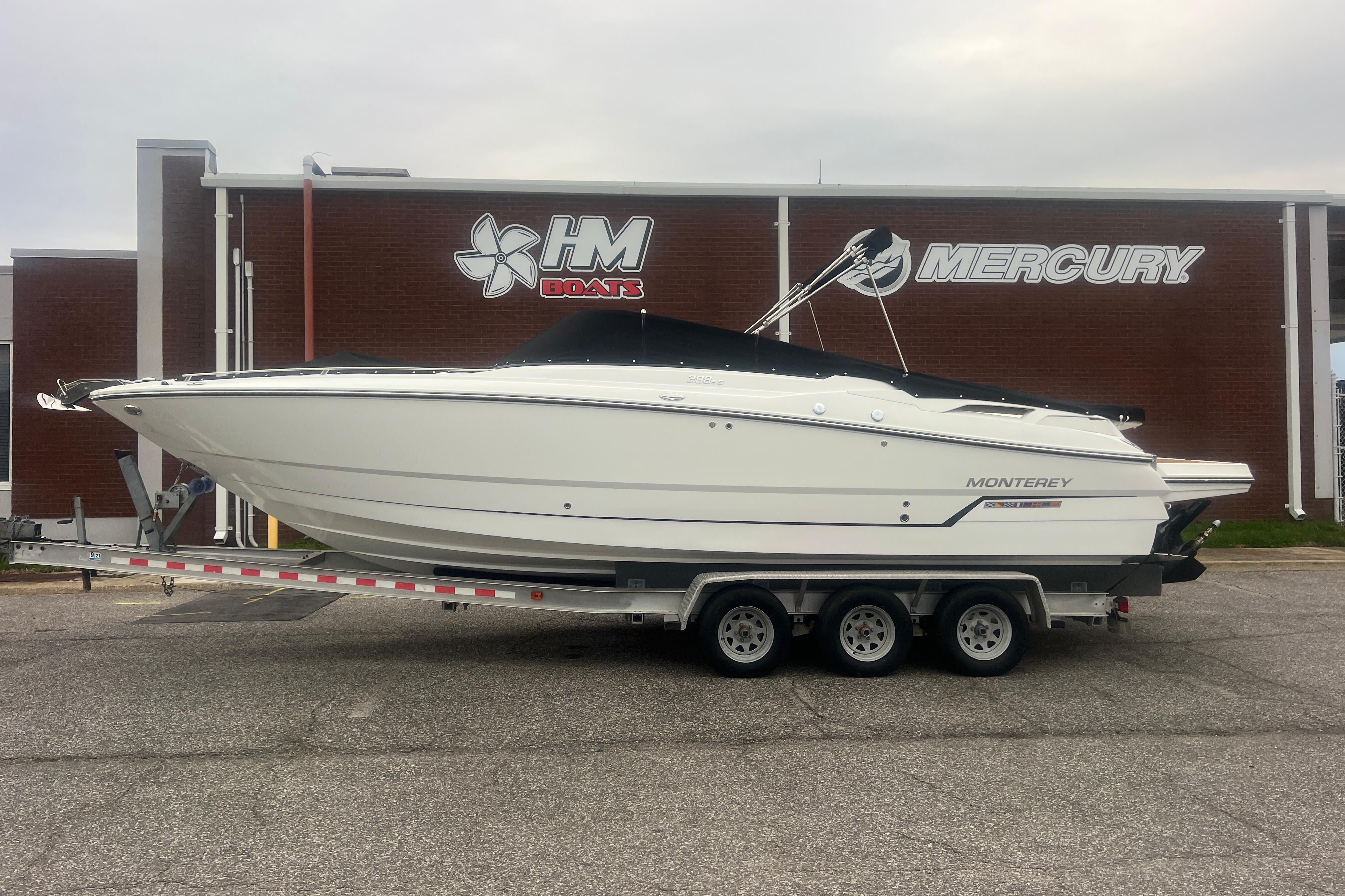 2017 Monterey 298SS Super Sport boat on trailer outside HM Boats and Mercury building.