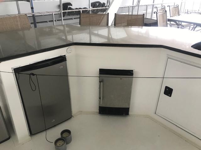 2002 Sumerset Houseboat interior with mini fridge and storage.