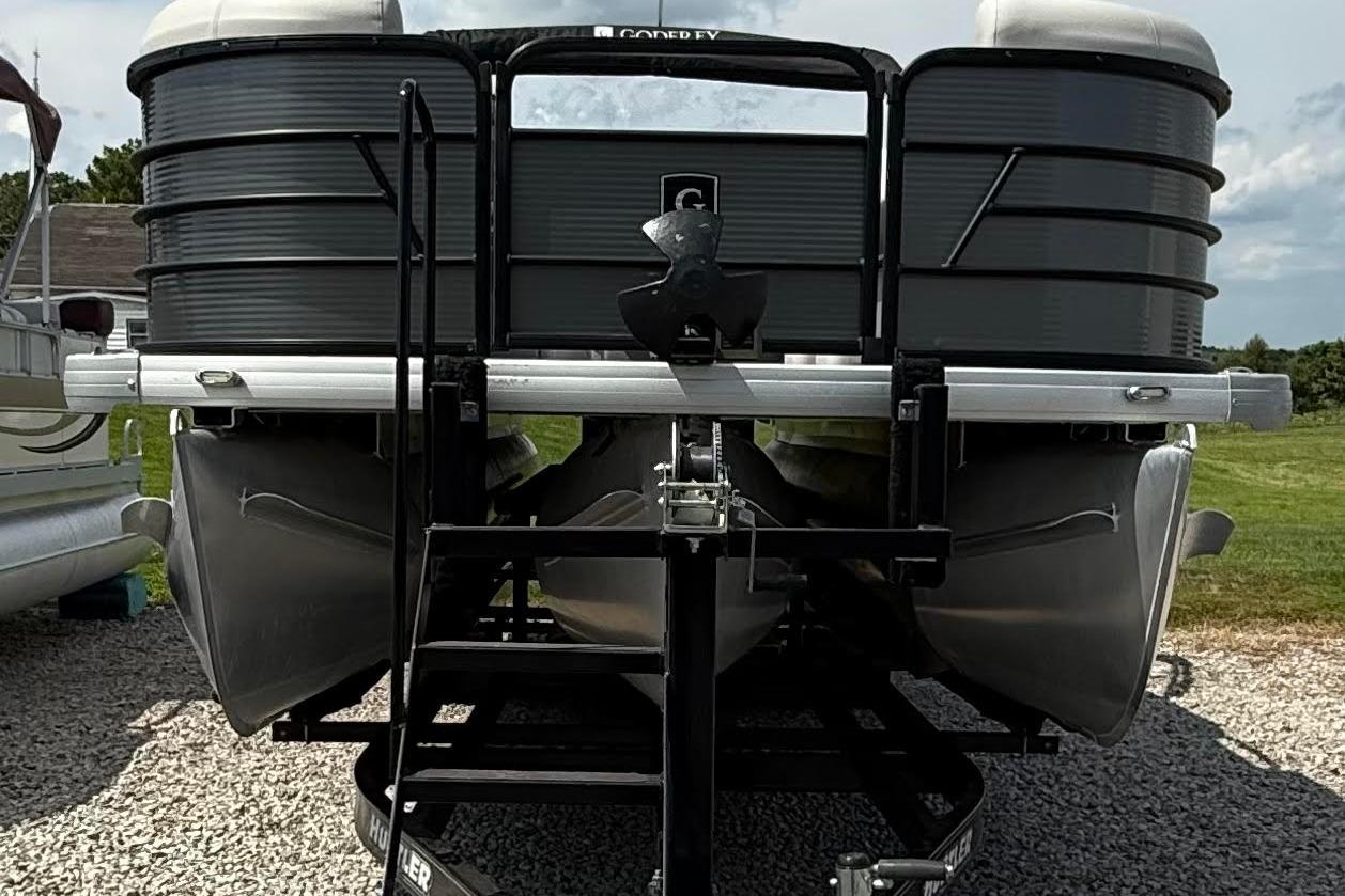 2022 Godfrey SWEETWATER 2486 pontoon boat on trailer, rear view.