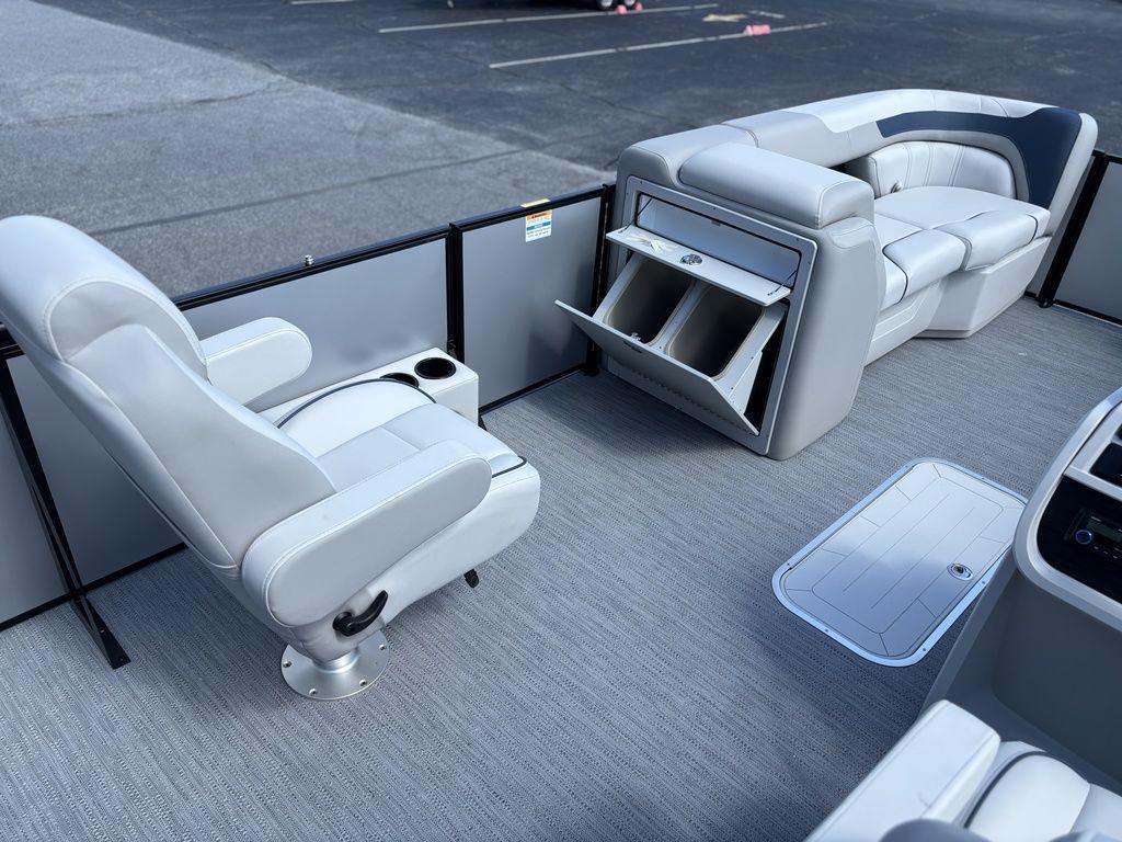 2026 Godfrey SWEETWATER 2286 SFL boat interior with gray seating and storage compartments.