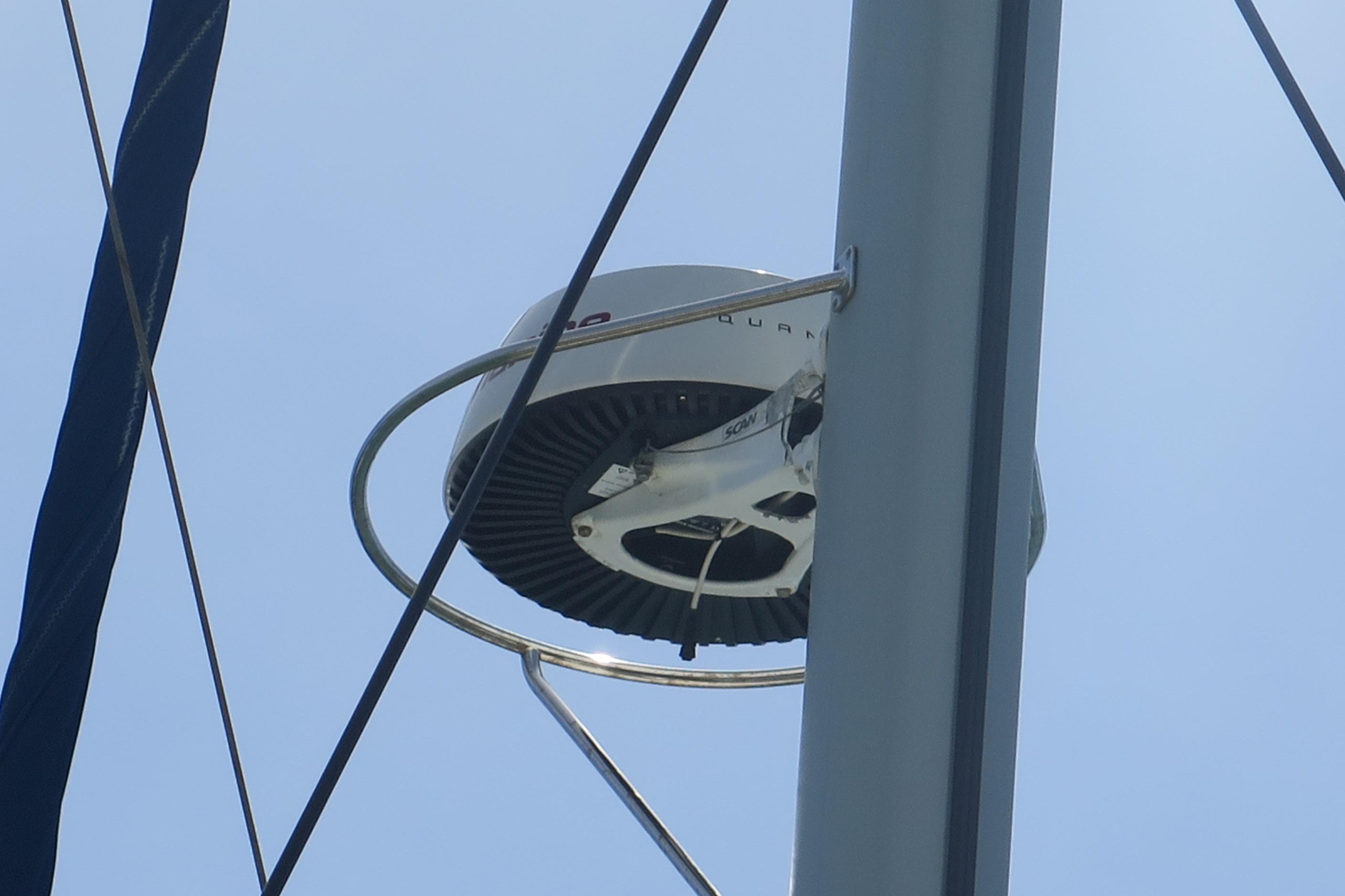 Radar equipment on a 2009 Leopard 46 sailboat mast against a clear sky.