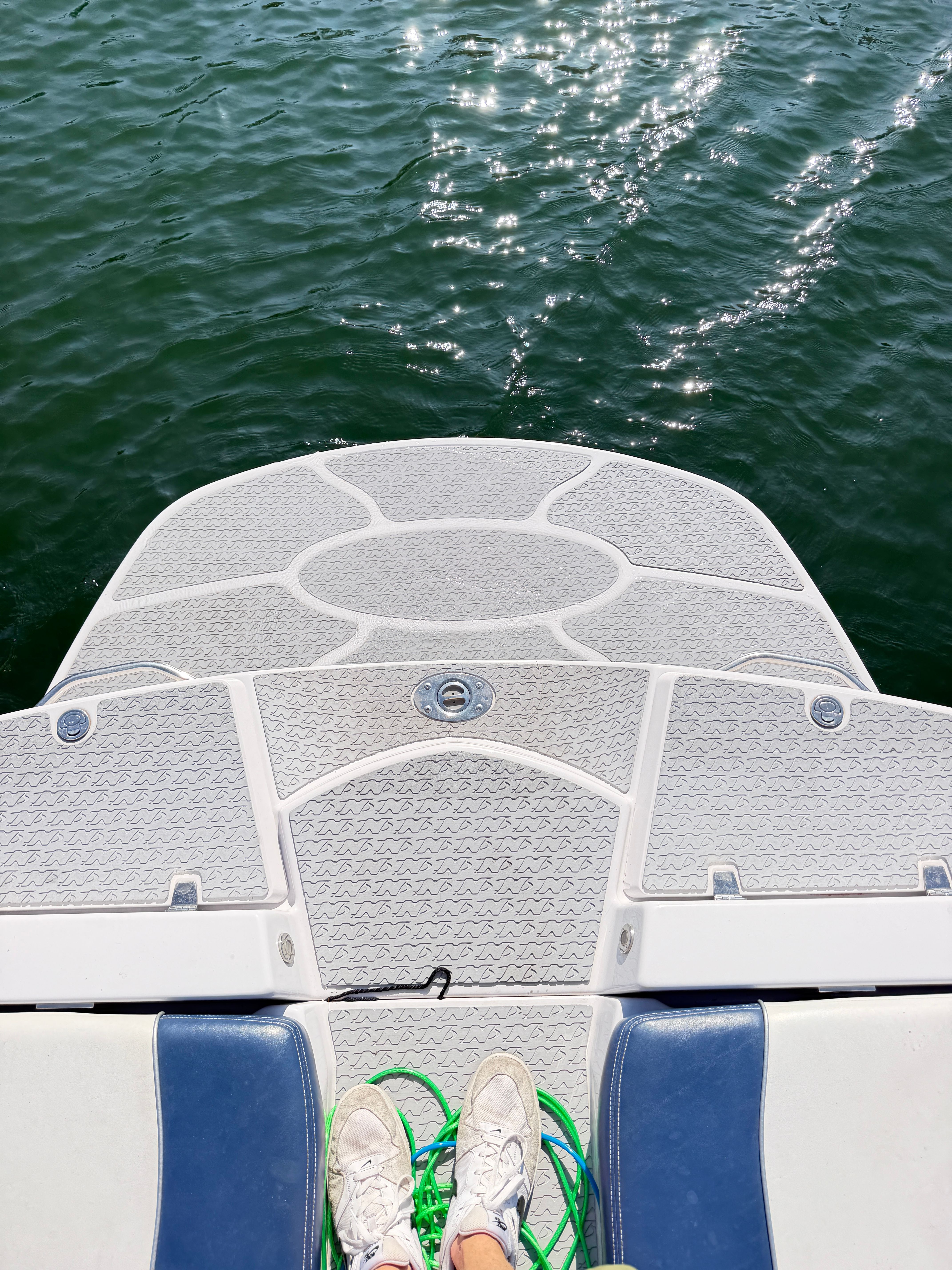 Rear view of a 2008 Nautique 236 Team Edition boat on the water.