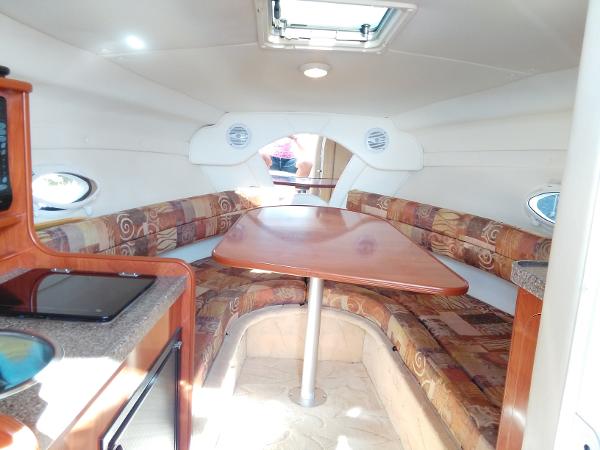 Interior of a 2004 Rinker Fiesta Vee 250 yacht with seating area.