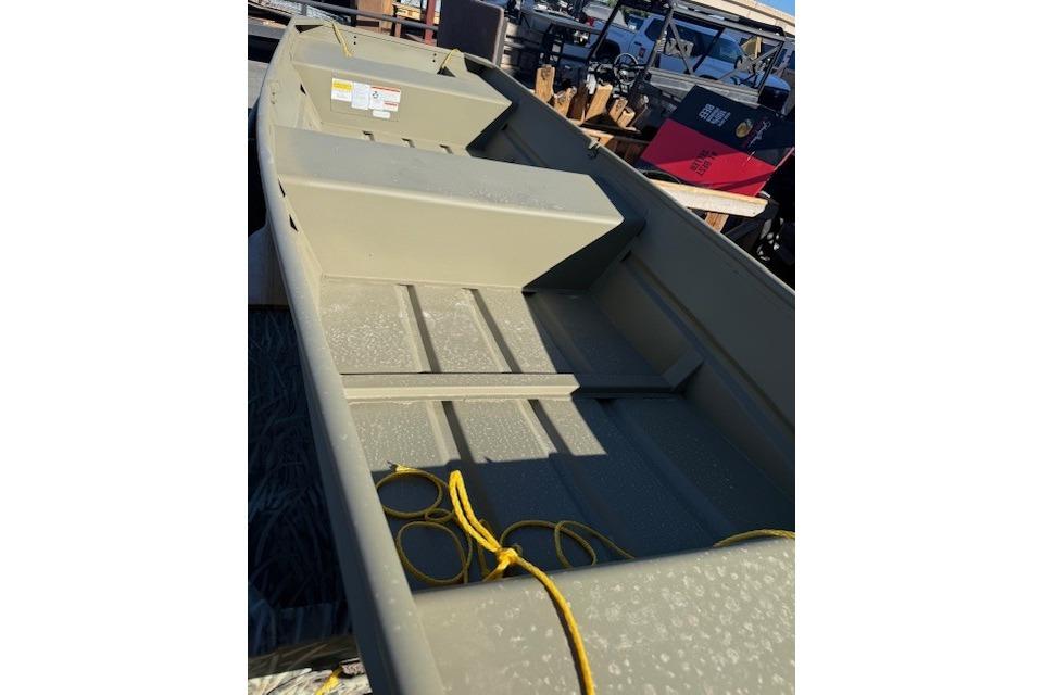 2026 Tracker Grizzly 14 Jon boat with yellow rope, parked outdoors.