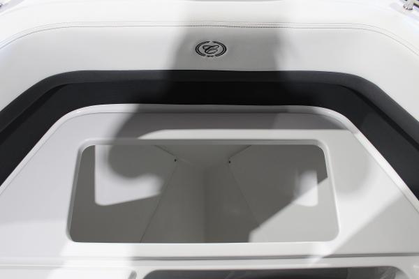 2025 Cobalt R6 boat interior storage compartment with sleek design and logo.