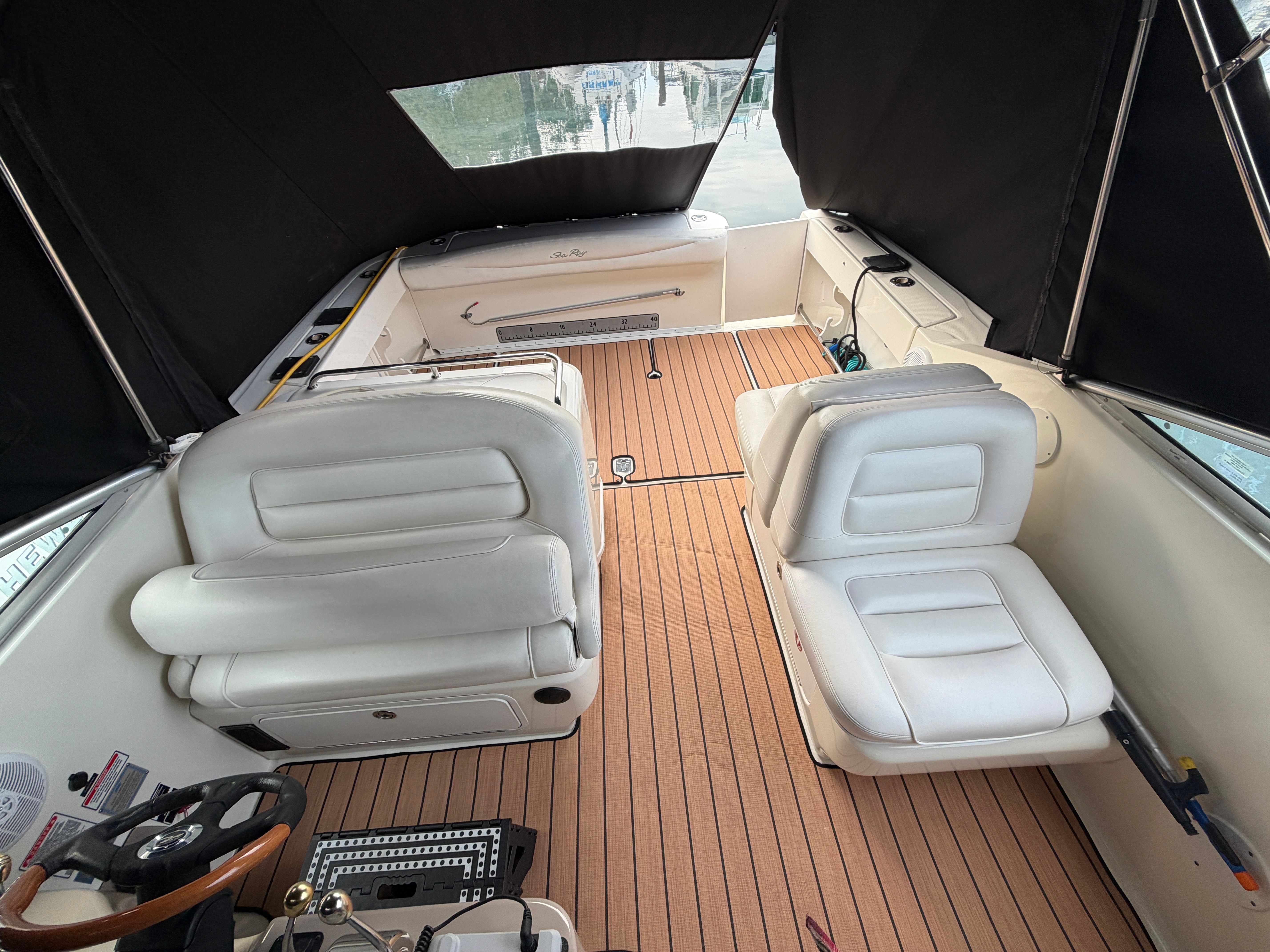 Interior of a 2005 Sea Ray 290 Amberjack with white seating.