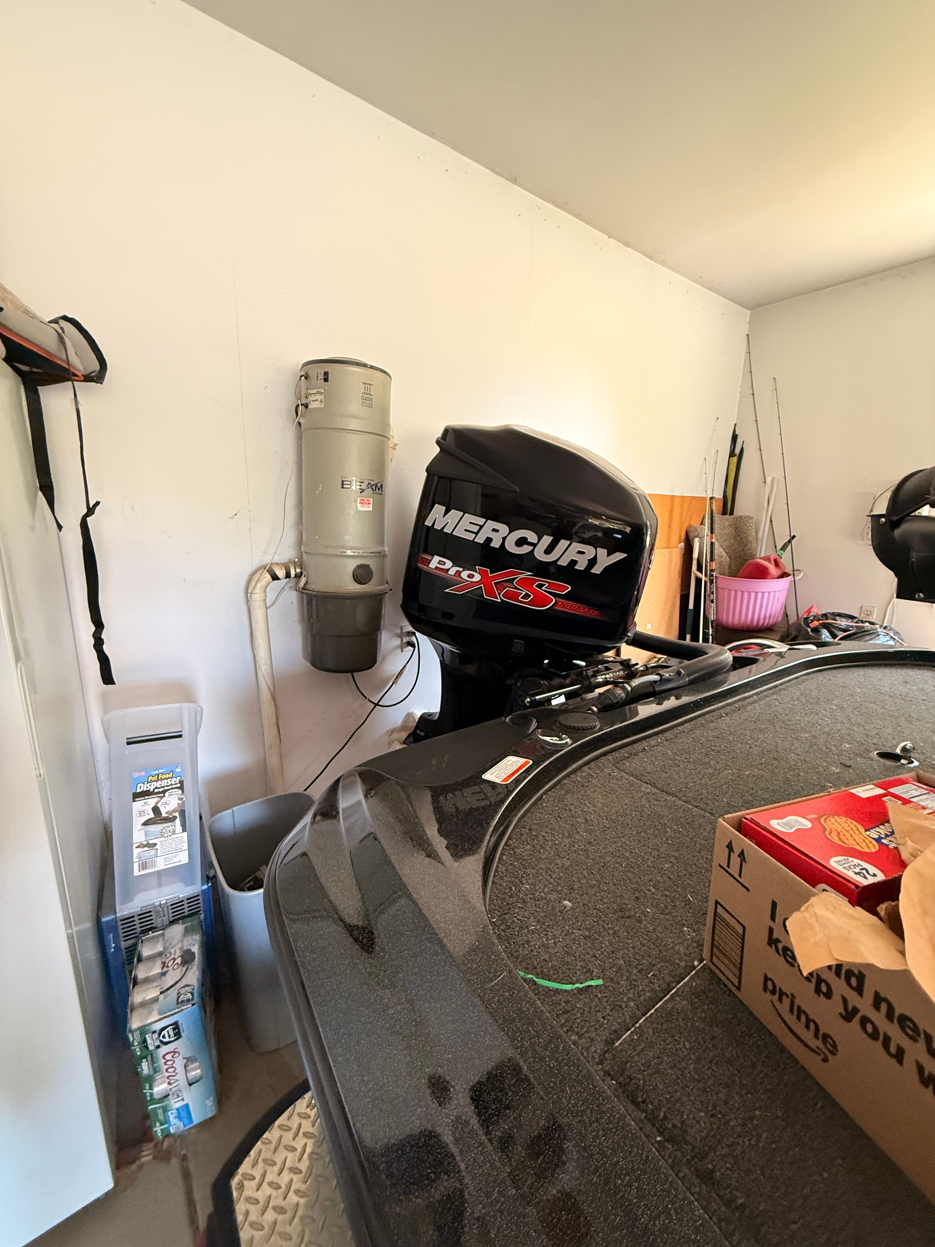 2018 Nitro Z19 Pro boat with Mercury Pro XS engine in garage.