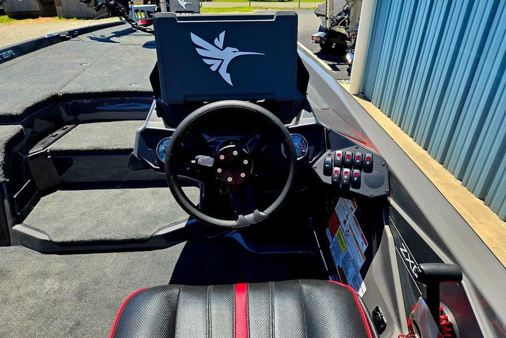 Interior of 2026 Skeeter ZXE20 boat with steering wheel and control panel.