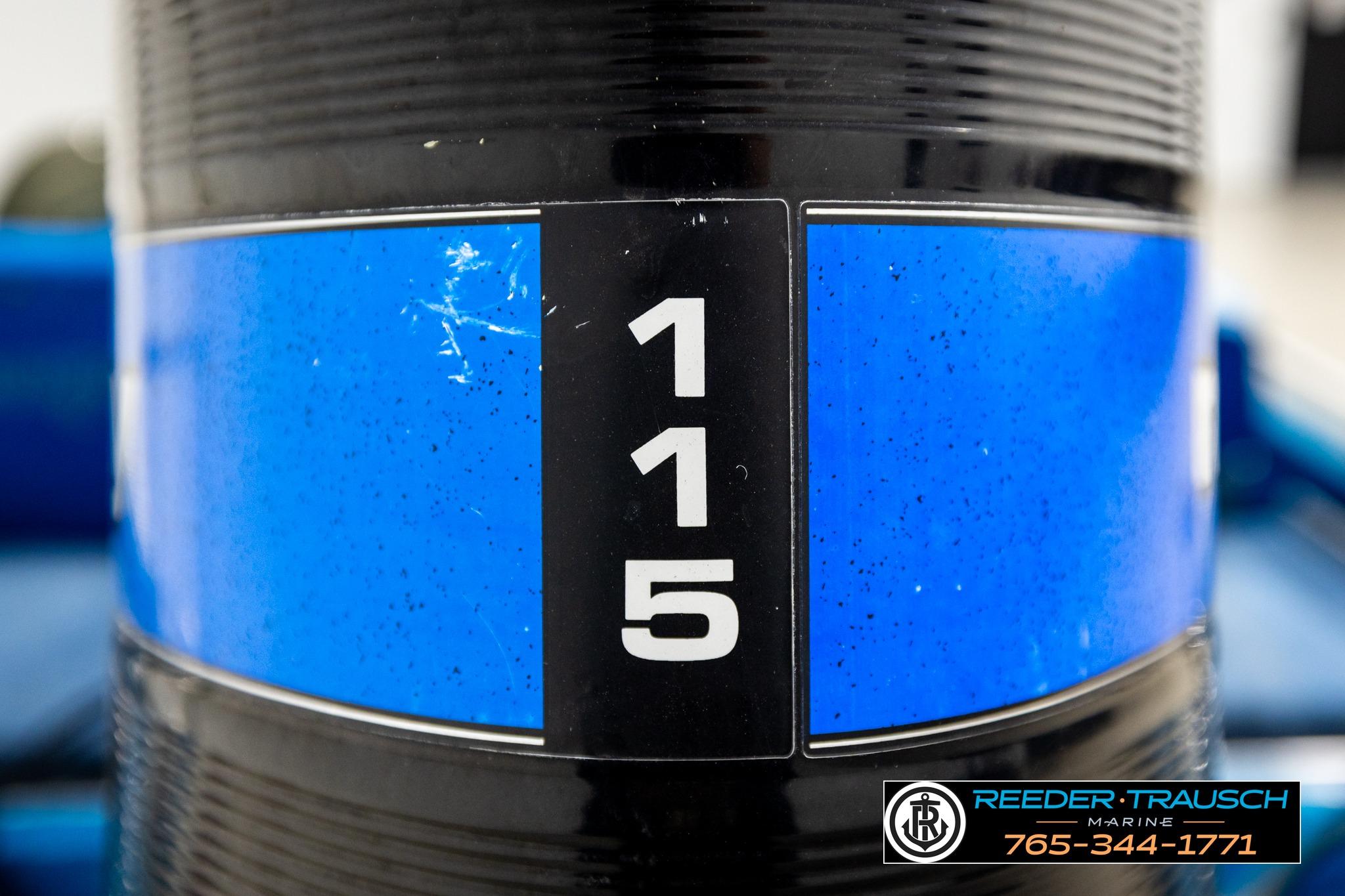 Close-up of a 1980 Ranger 175 VS boat engine with "115" label.