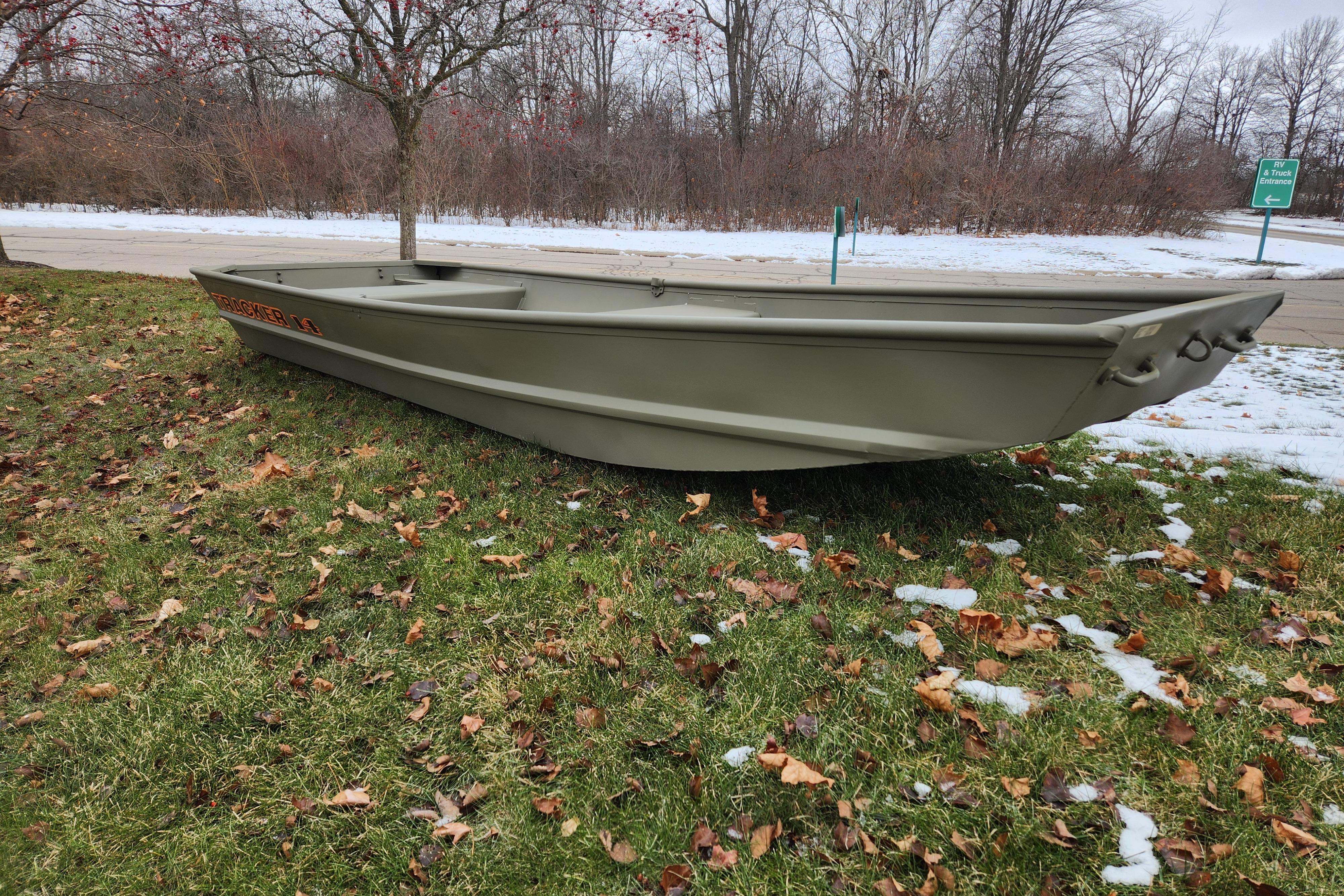 2026 Tracker Grizzly 14 Jon boat on grass with snowy background.