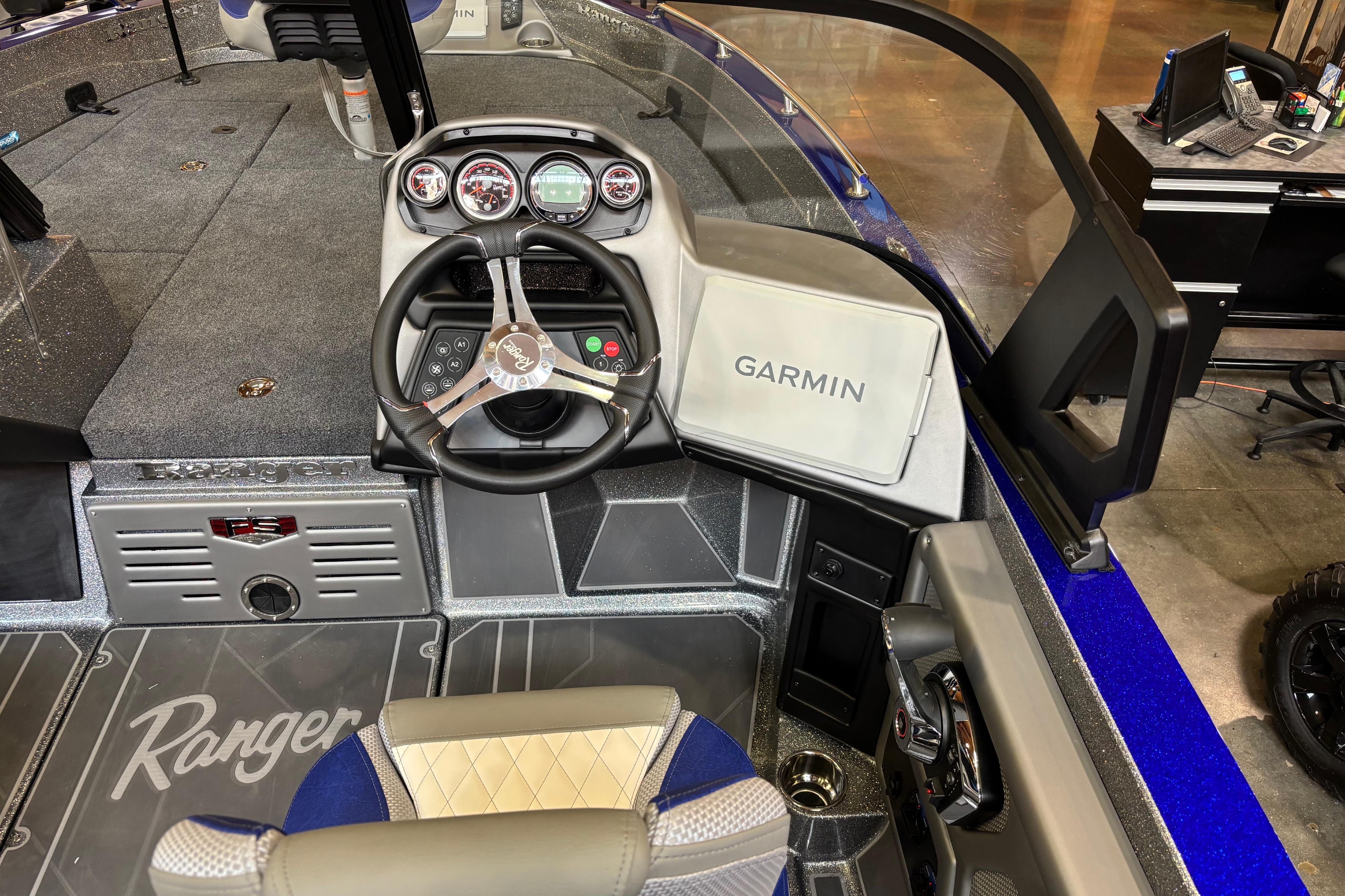 2026 Ranger 621FS Cup-Equipped boat interior with Garmin navigation system and steering wheel.