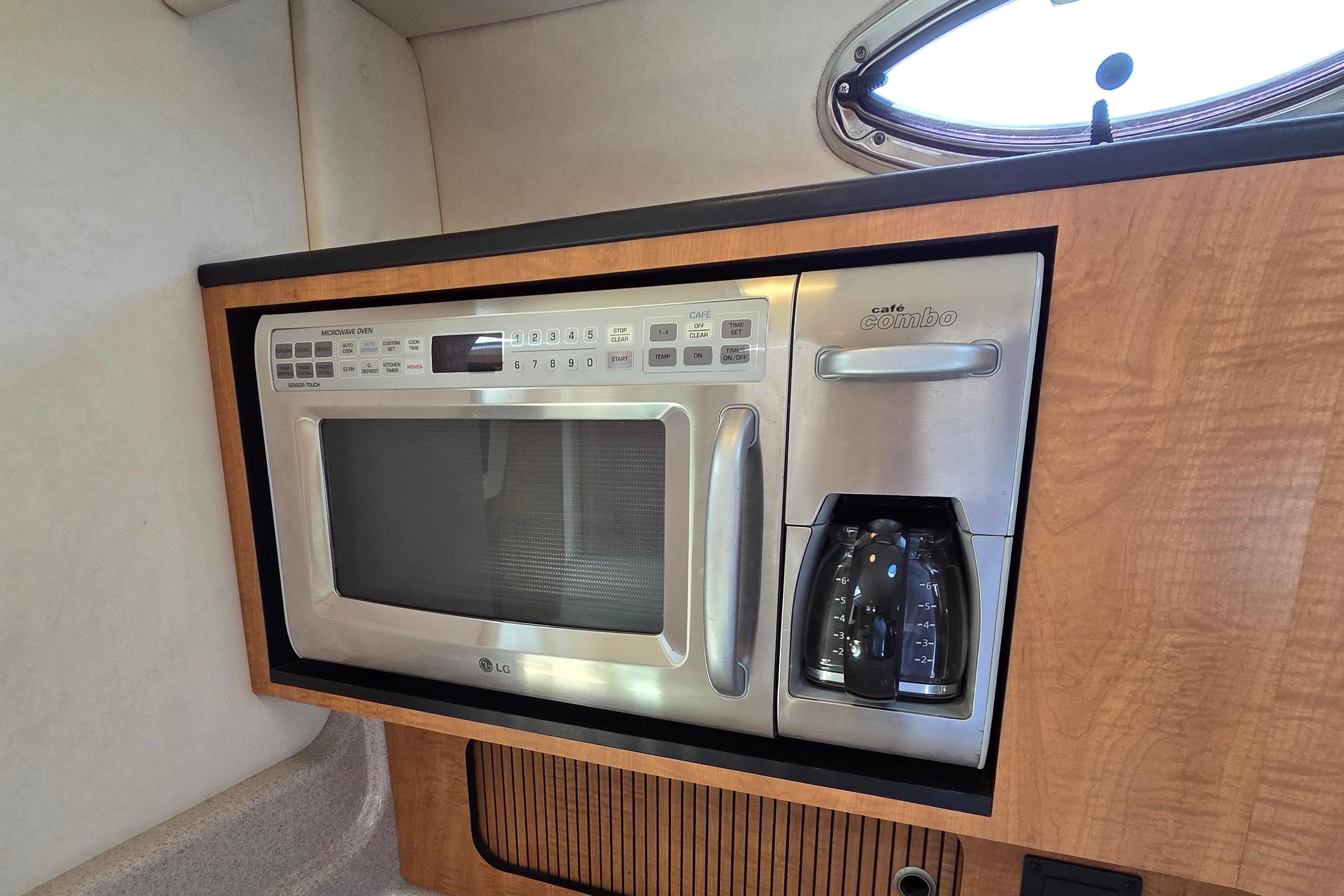 Built-in microwave and coffee maker in 2006 Sea Ray Sundancer 320 yacht kitchen.