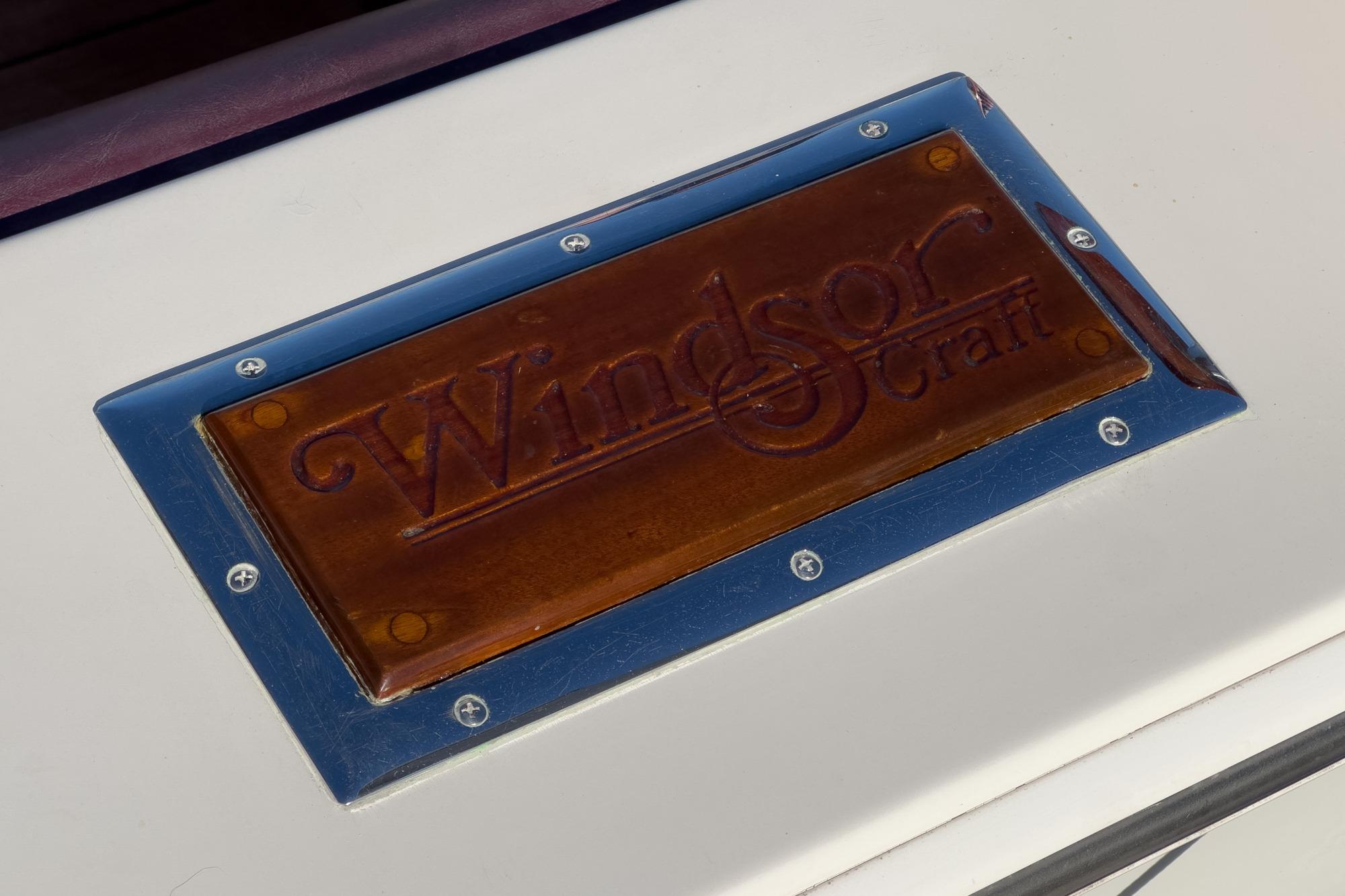 Plaque displaying "Windsor Craft" on a 1991 31 Sport Cruiser boat.