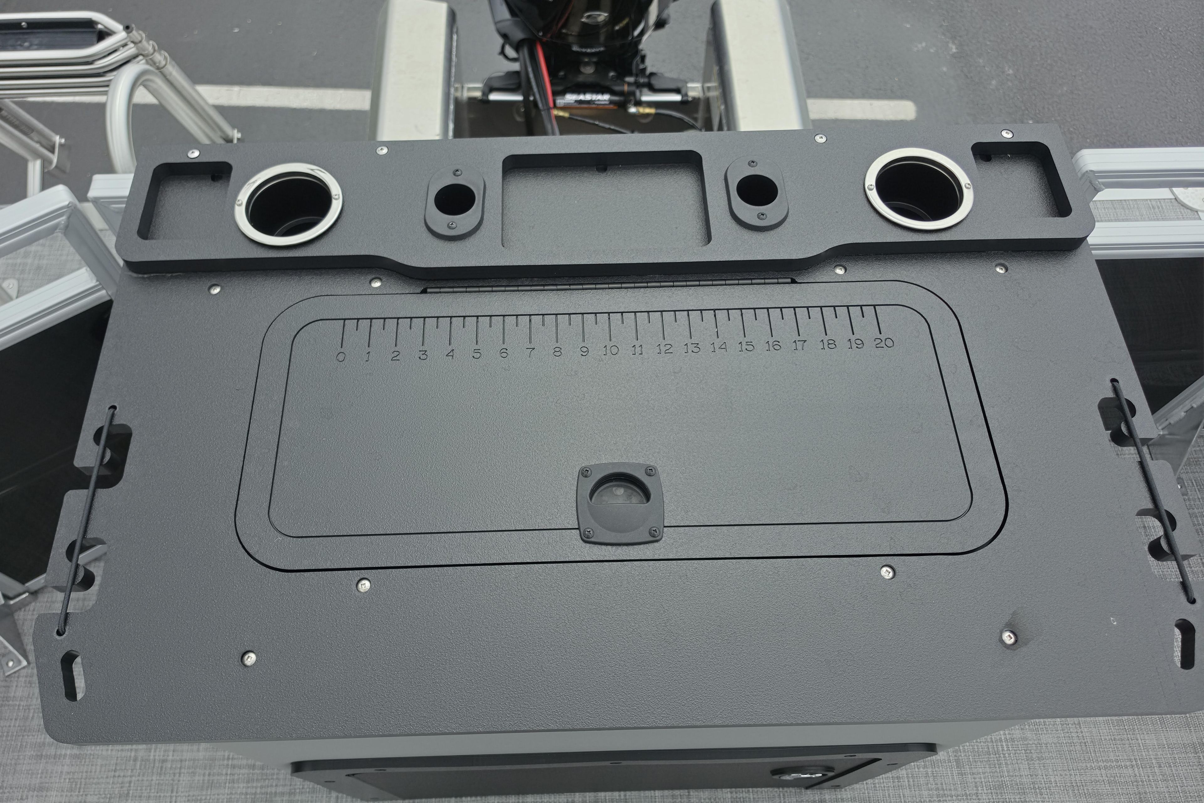 2026 Sun Tracker SportFish 22 XP3 fishing station with integrated measuring board and cup holders.