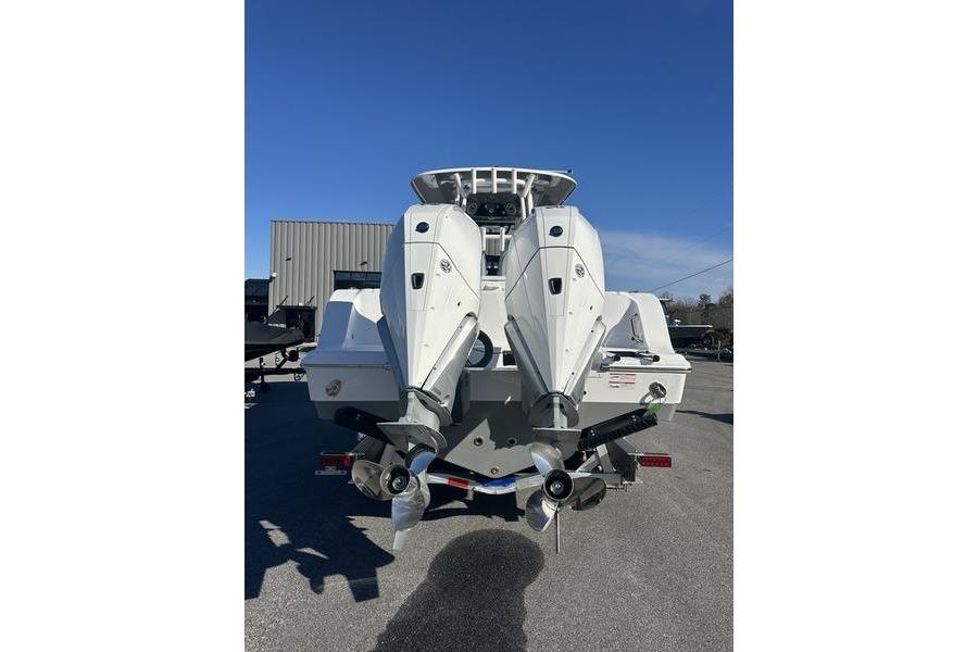 2026 Sportsman Open 282 Center Console boat with dual outboard engines.