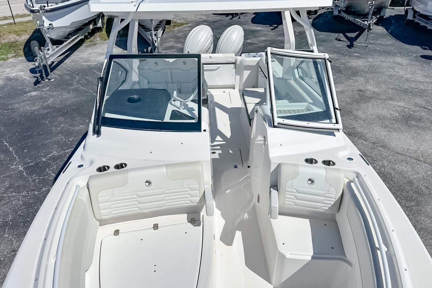 2025 Edgewater 262CX Crossover boat interior with seating and open windshield.