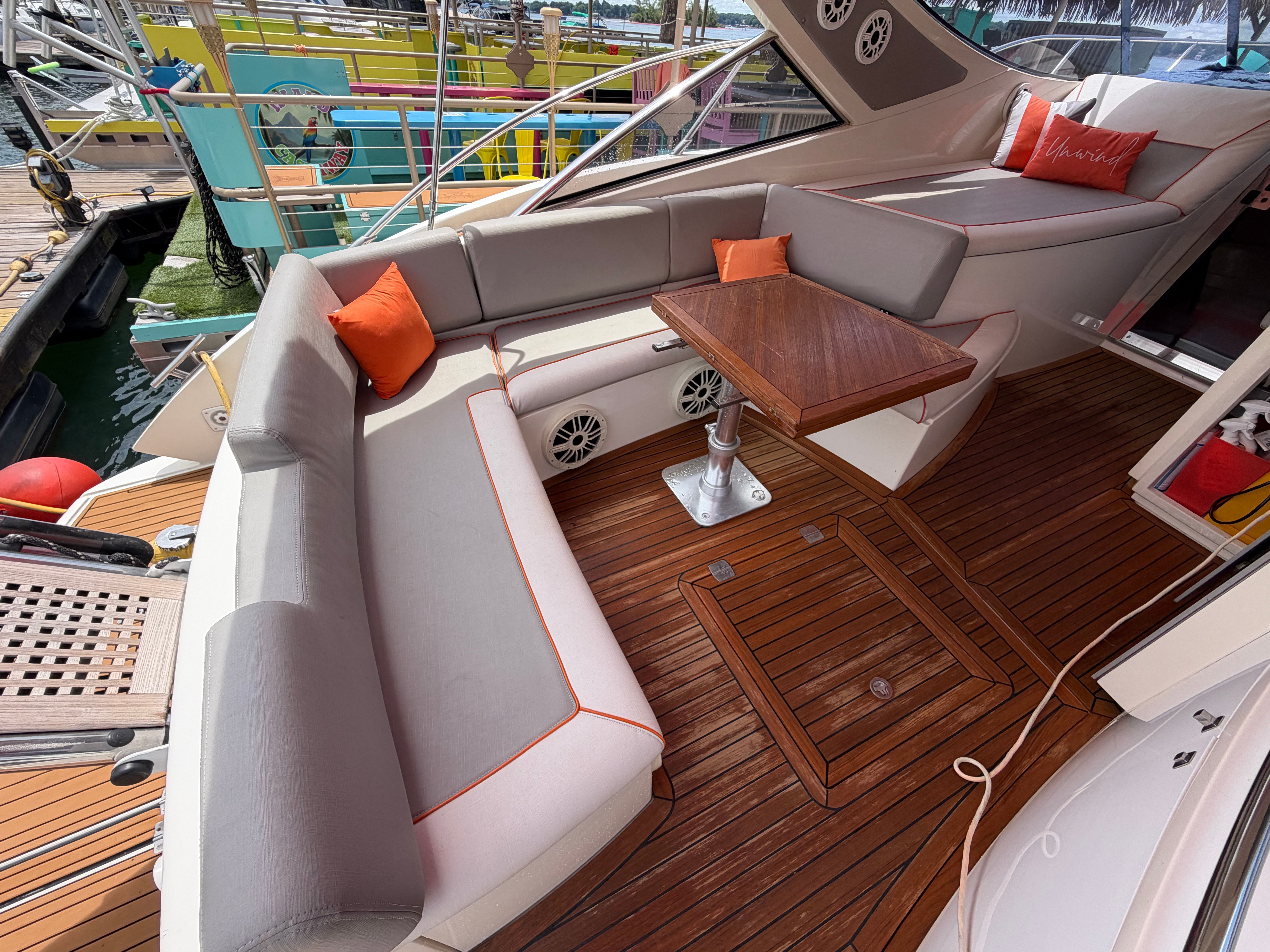 The image shows the cockpit of a 2011 Azimut Atlantis 40 with elegant seating.